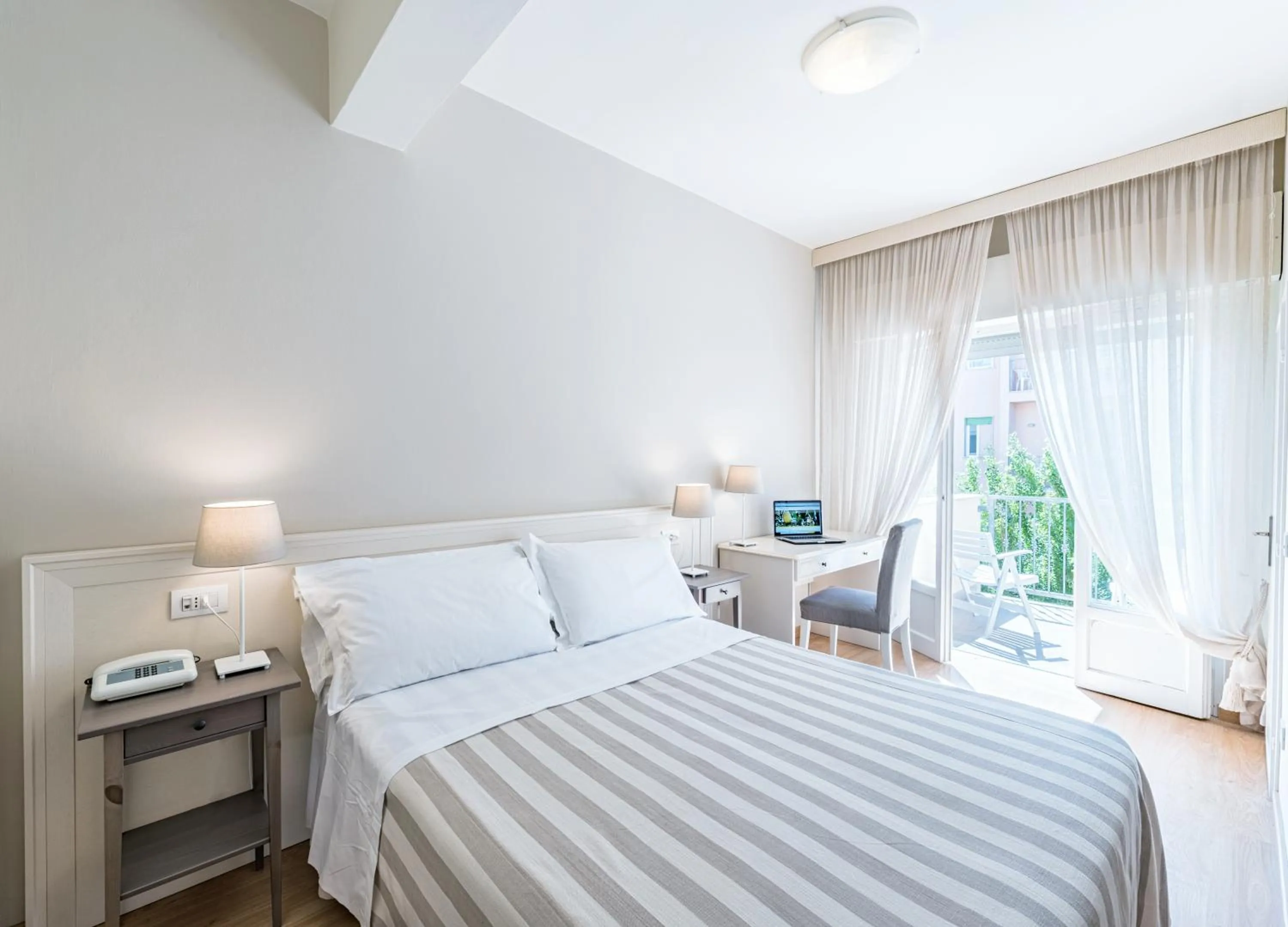 Bed in Hotel Andreaneri