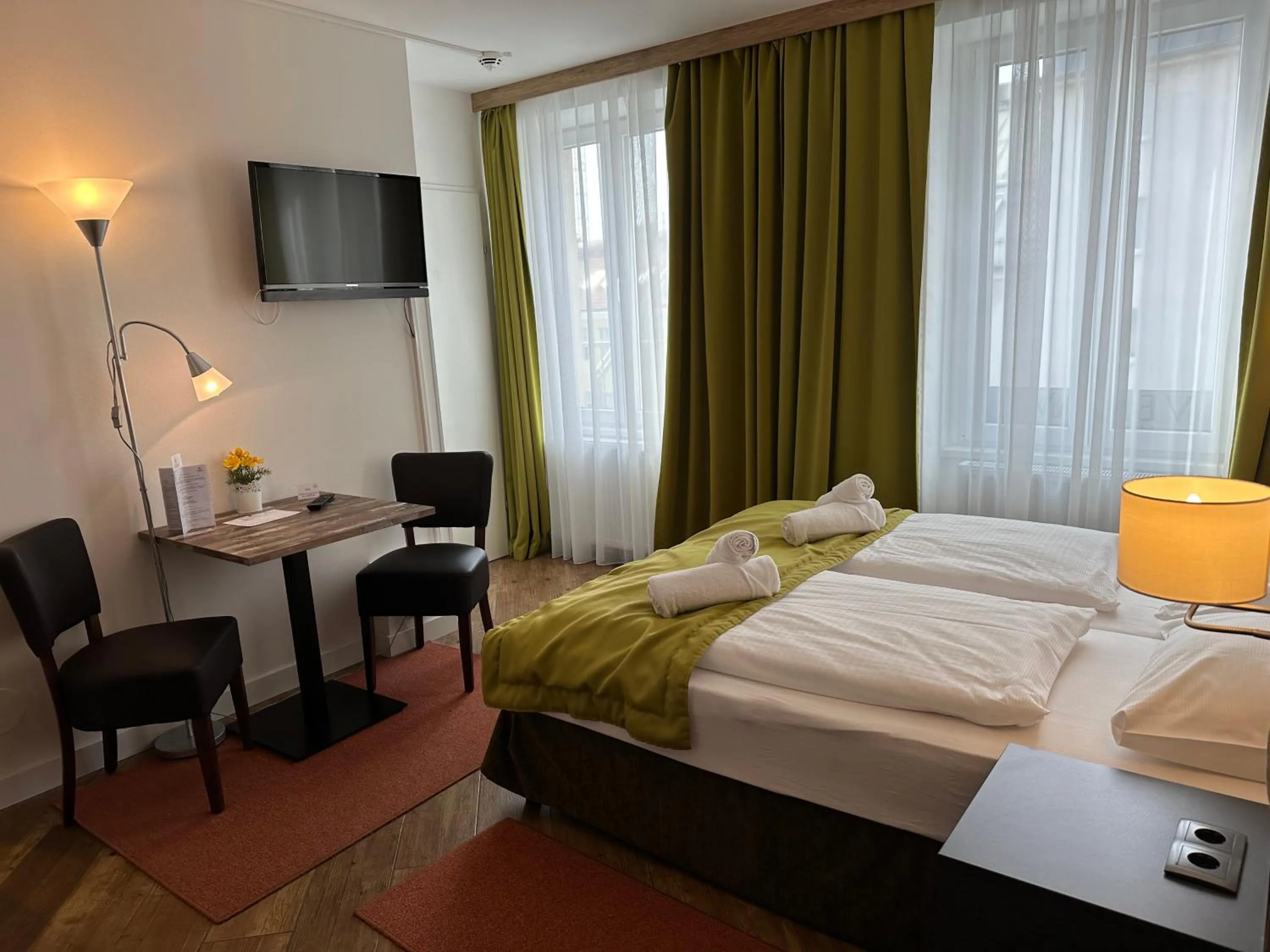 Bed in Versava Apartments