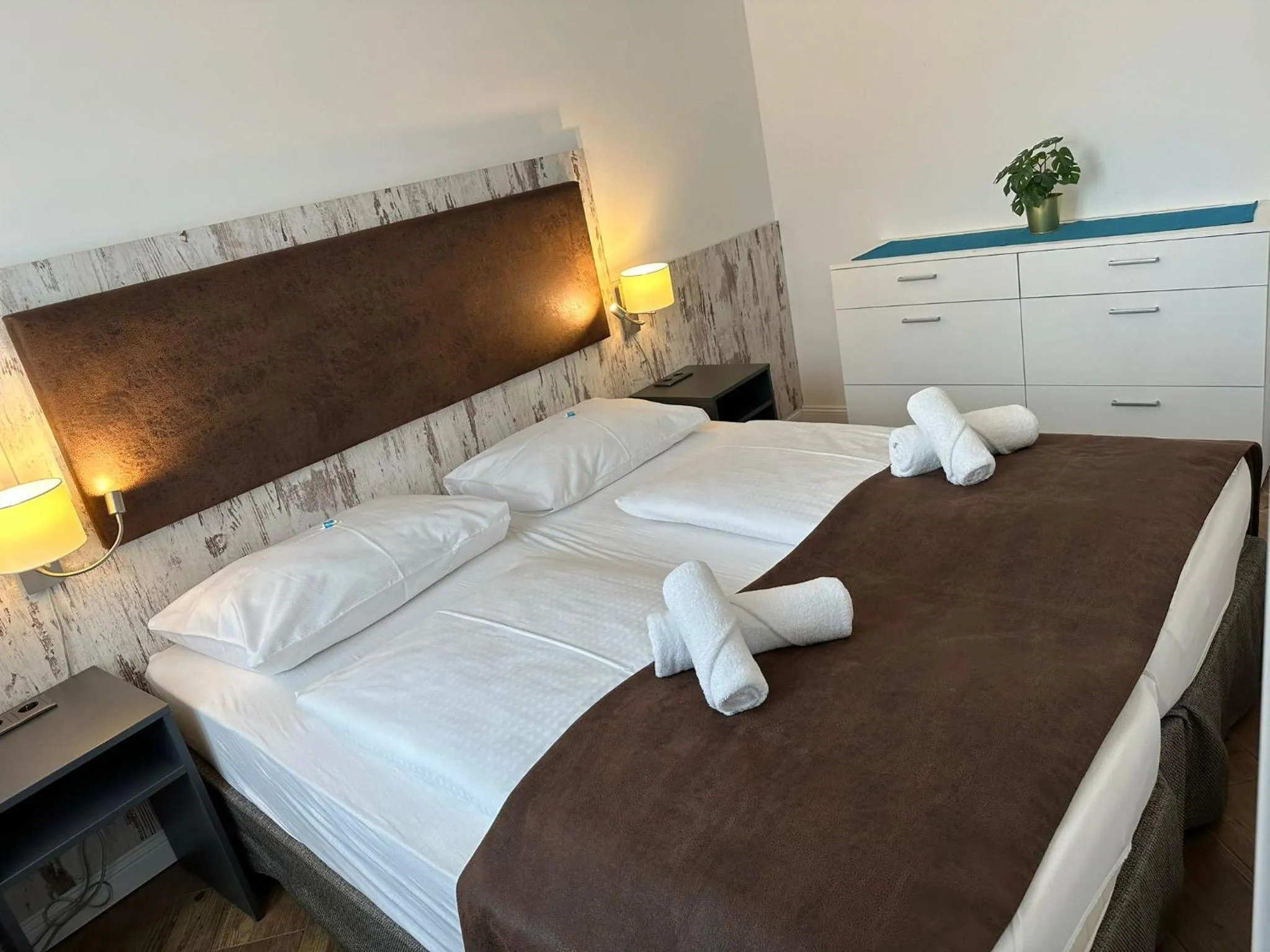 Bed in Versava Apartments