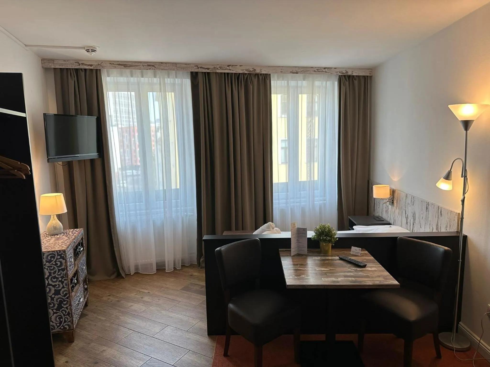 Bed in Versava Apartments