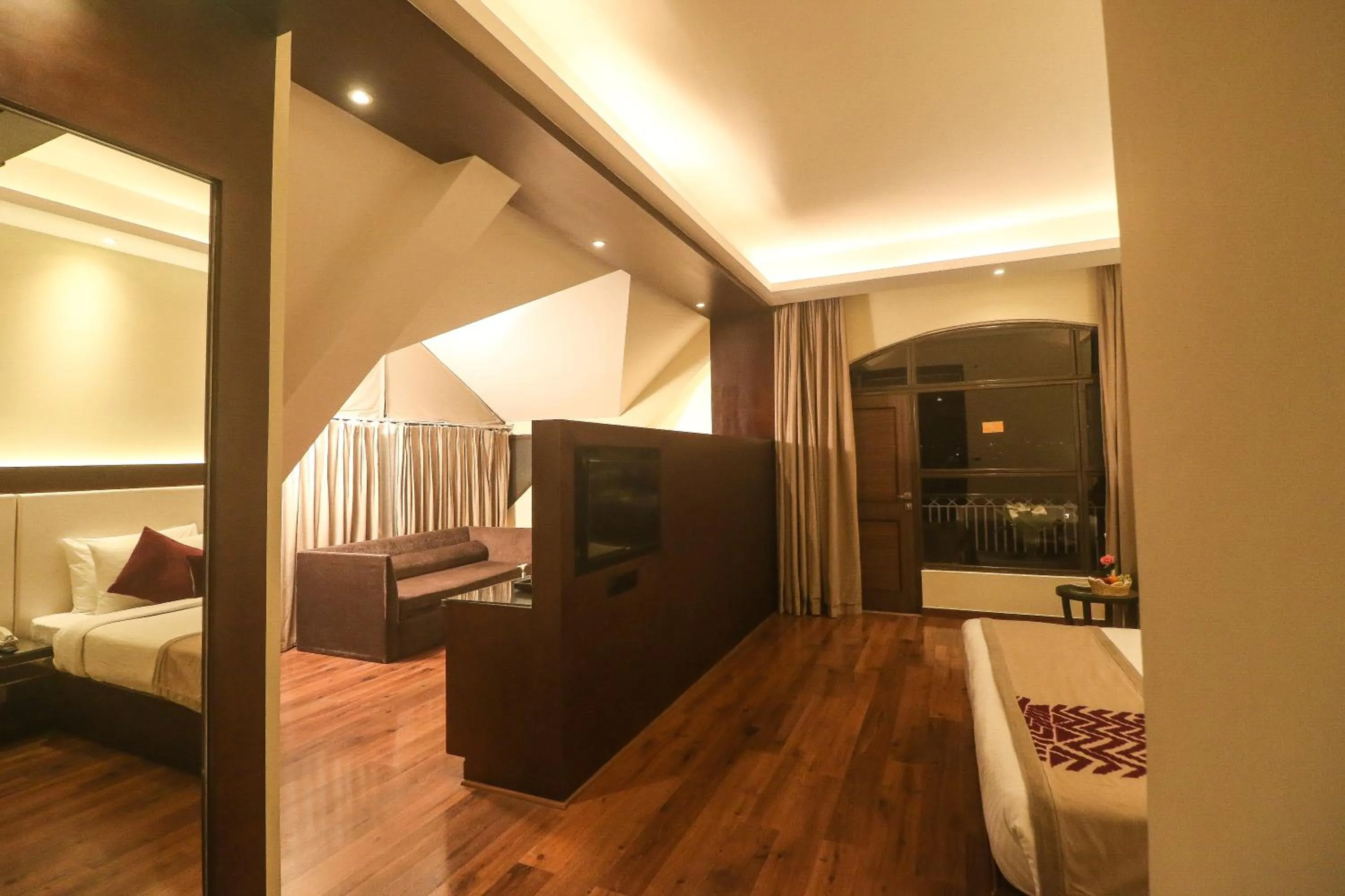 Seating area, Bed in Marigold Sarovar Portico Shimla