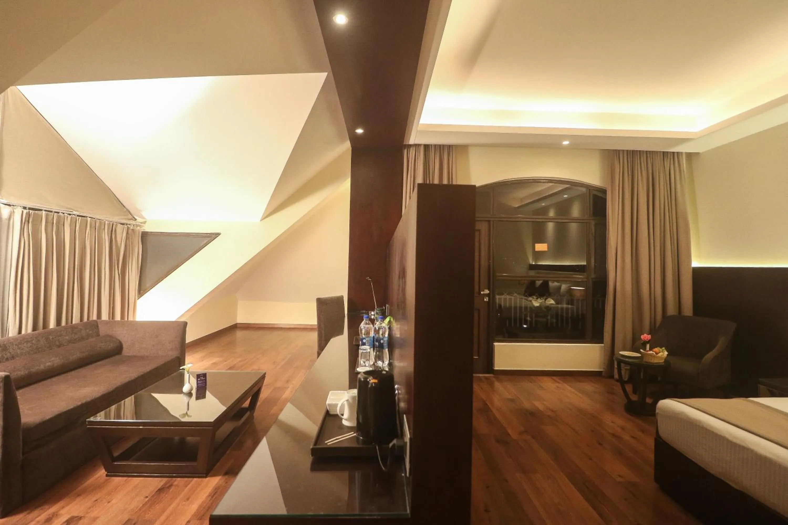 Living room, Bed in Marigold Sarovar Portico Shimla