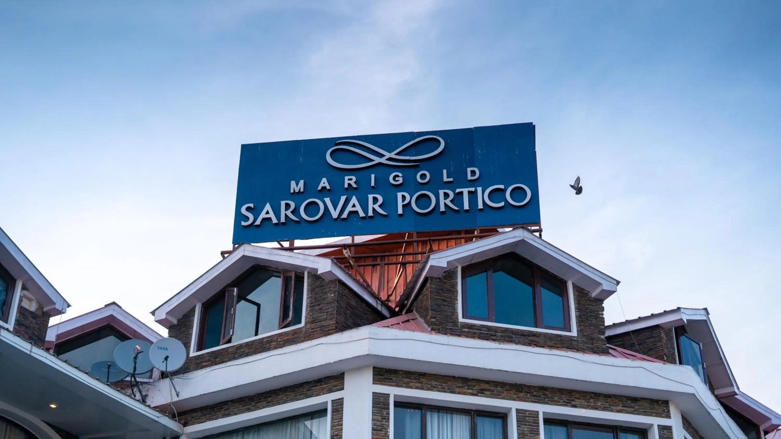 Property logo or sign in Marigold Sarovar Portico Shimla
