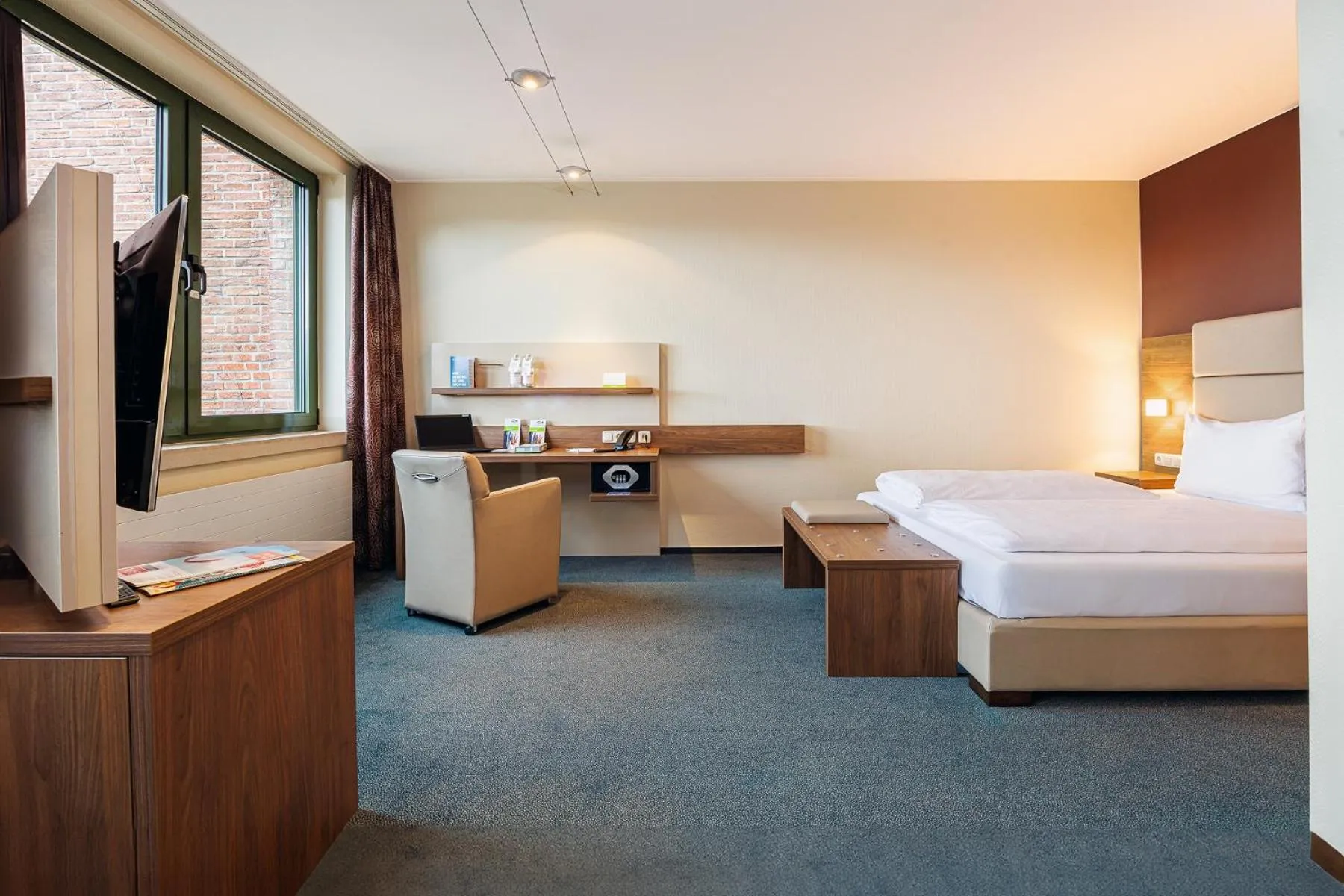 Photo of the whole room, Bed in GenoHotel Forsbach
