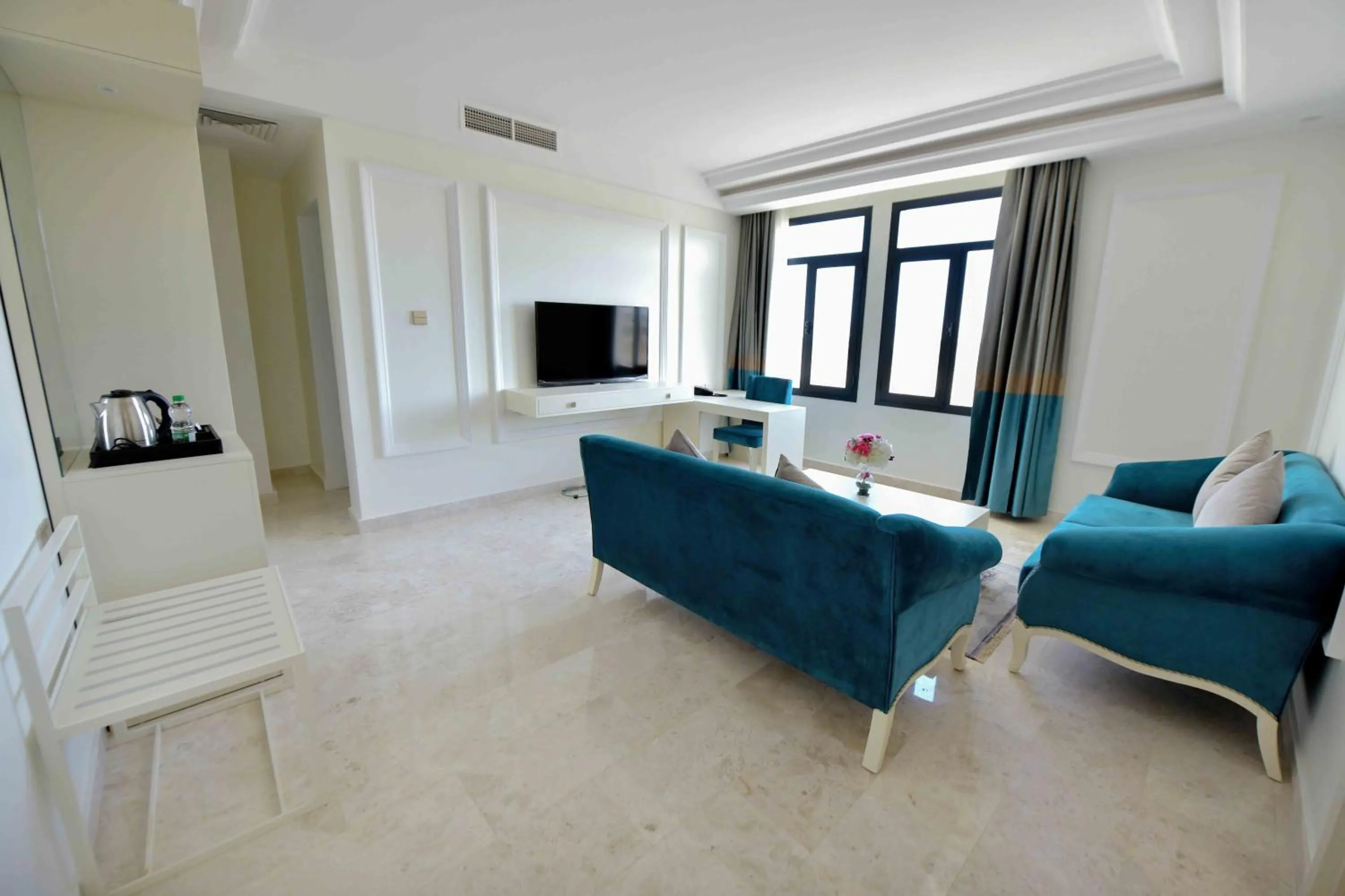 Communal lounge/ TV room in Be Inn Hotel