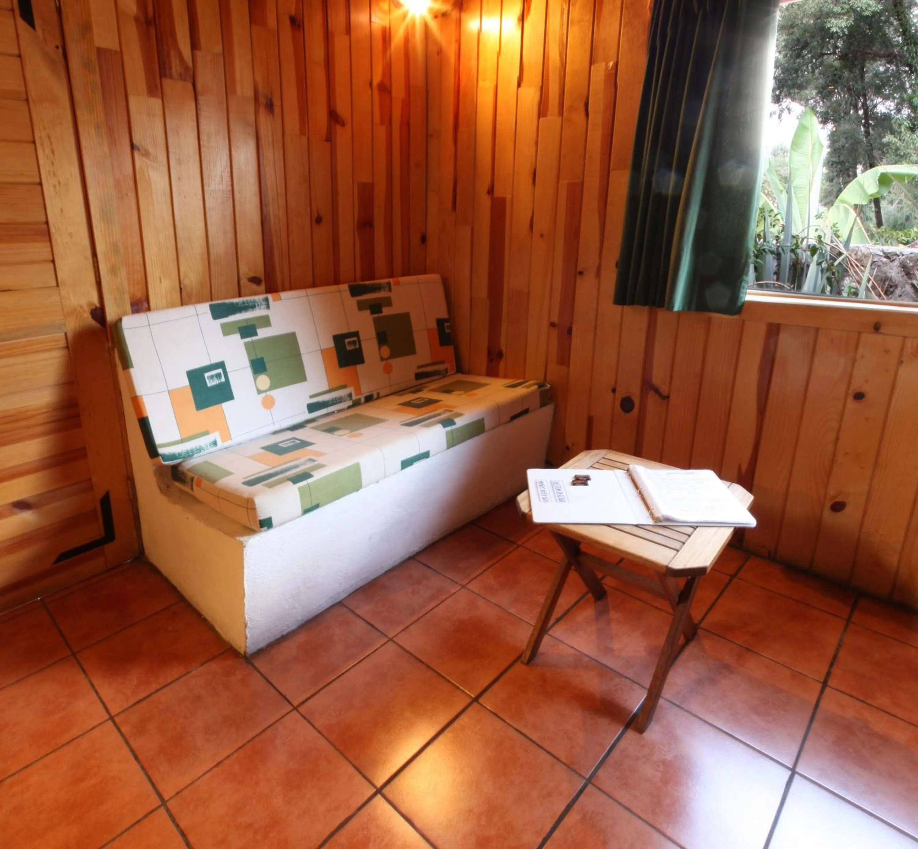Living room, Bed in Cabañas El Estribo Hotel