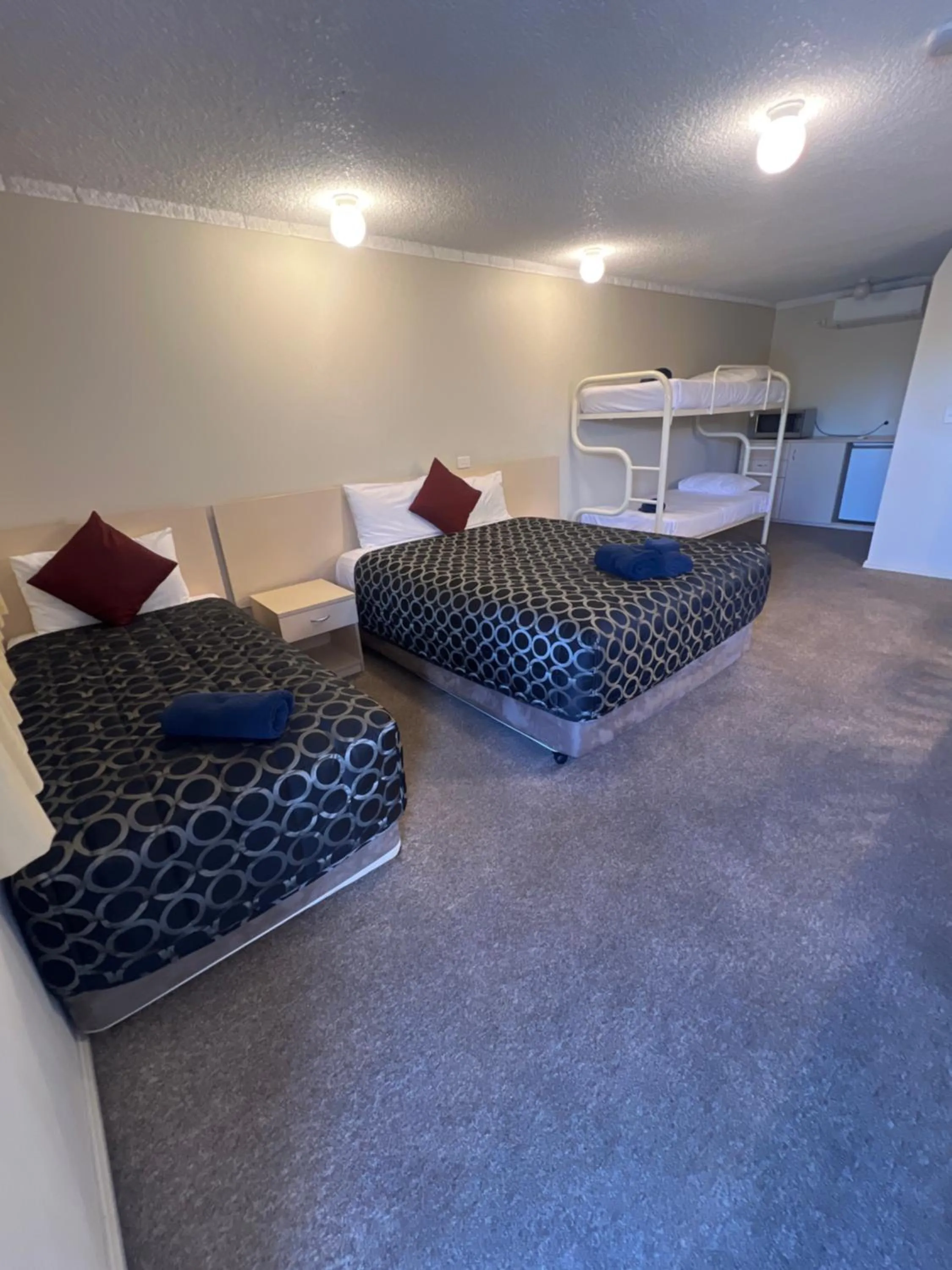 Bed in OVERLANDER MOTOR LODGE