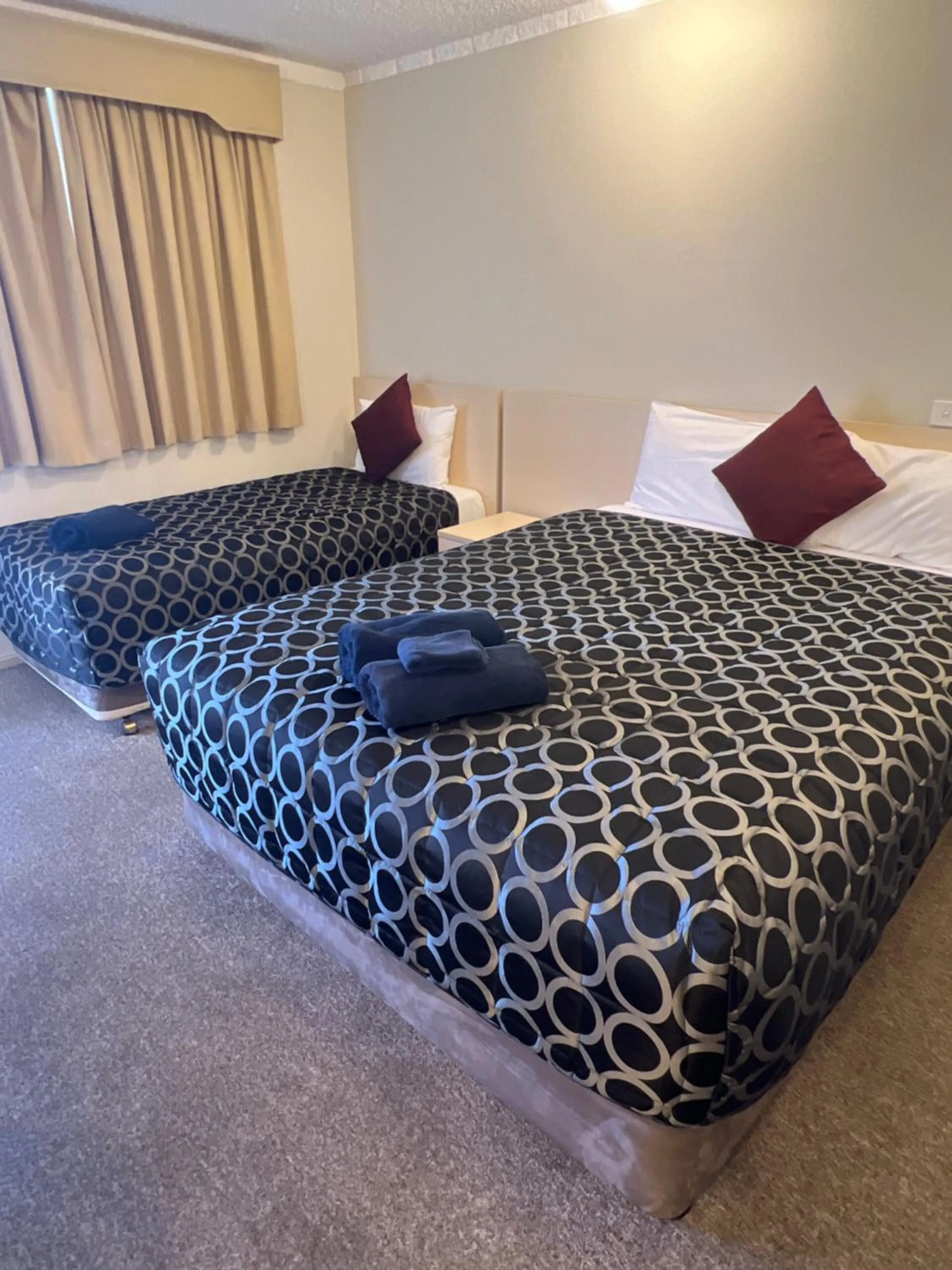 Bed in OVERLANDER MOTOR LODGE