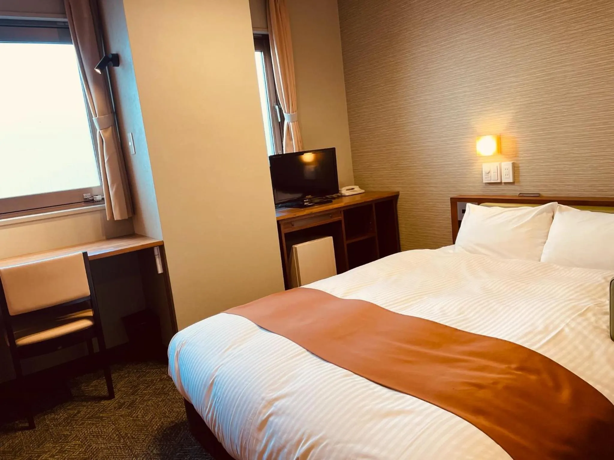 Bed in Shizuoka Town Hotel