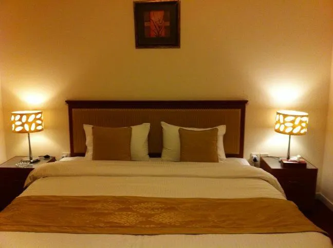 Bed in Al Jazeera Hotel Apartments LLC