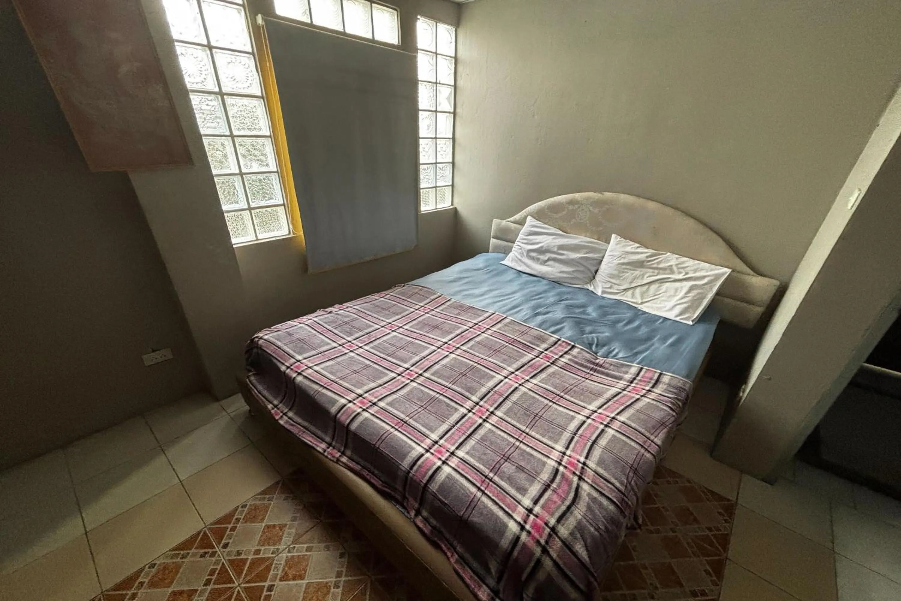 Bed in OYO 457 Panasan Villa