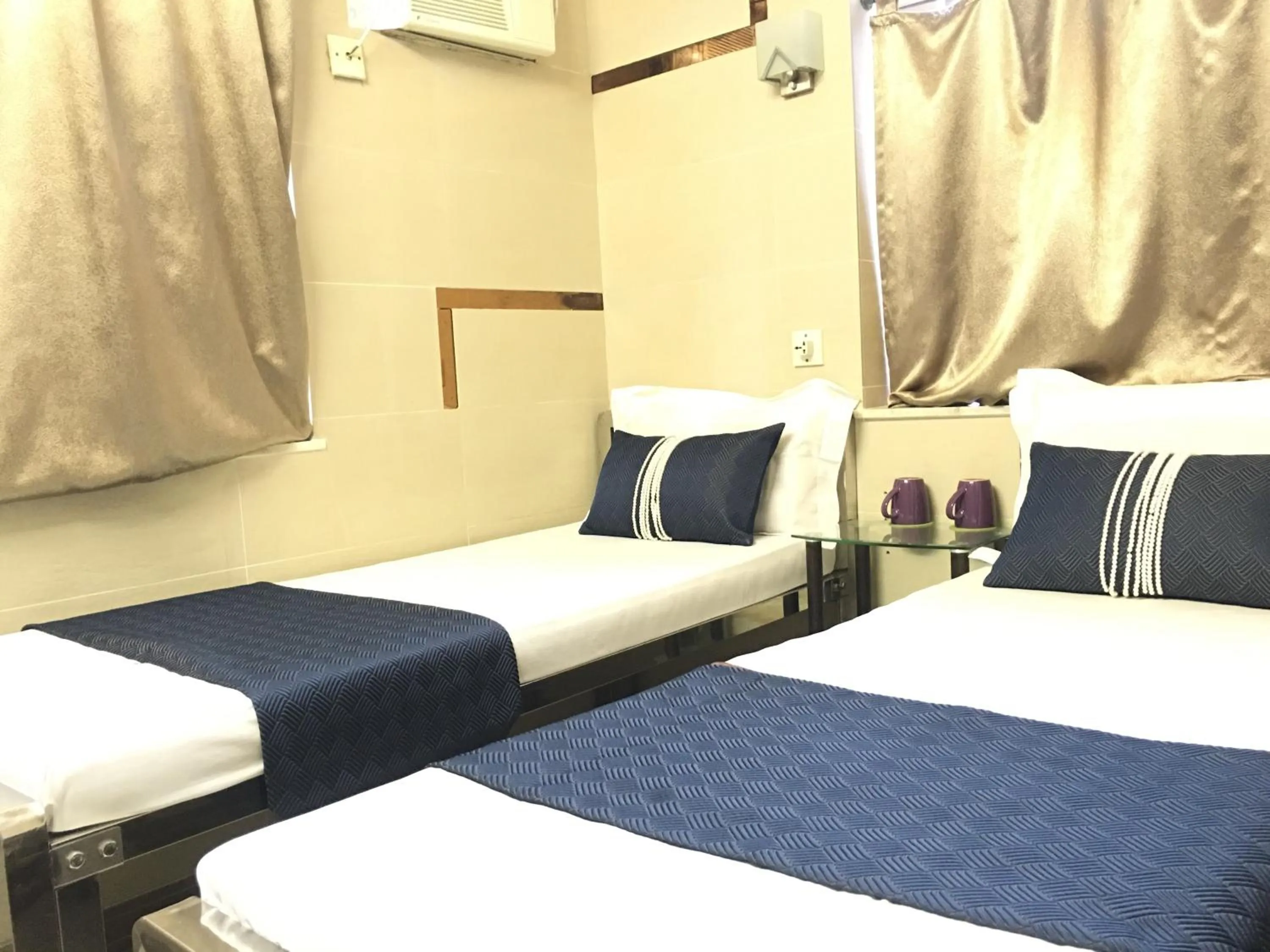 Bed in New Grand Guest House