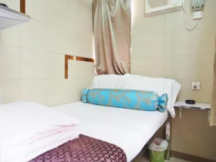 Bed in New Grand Guest House