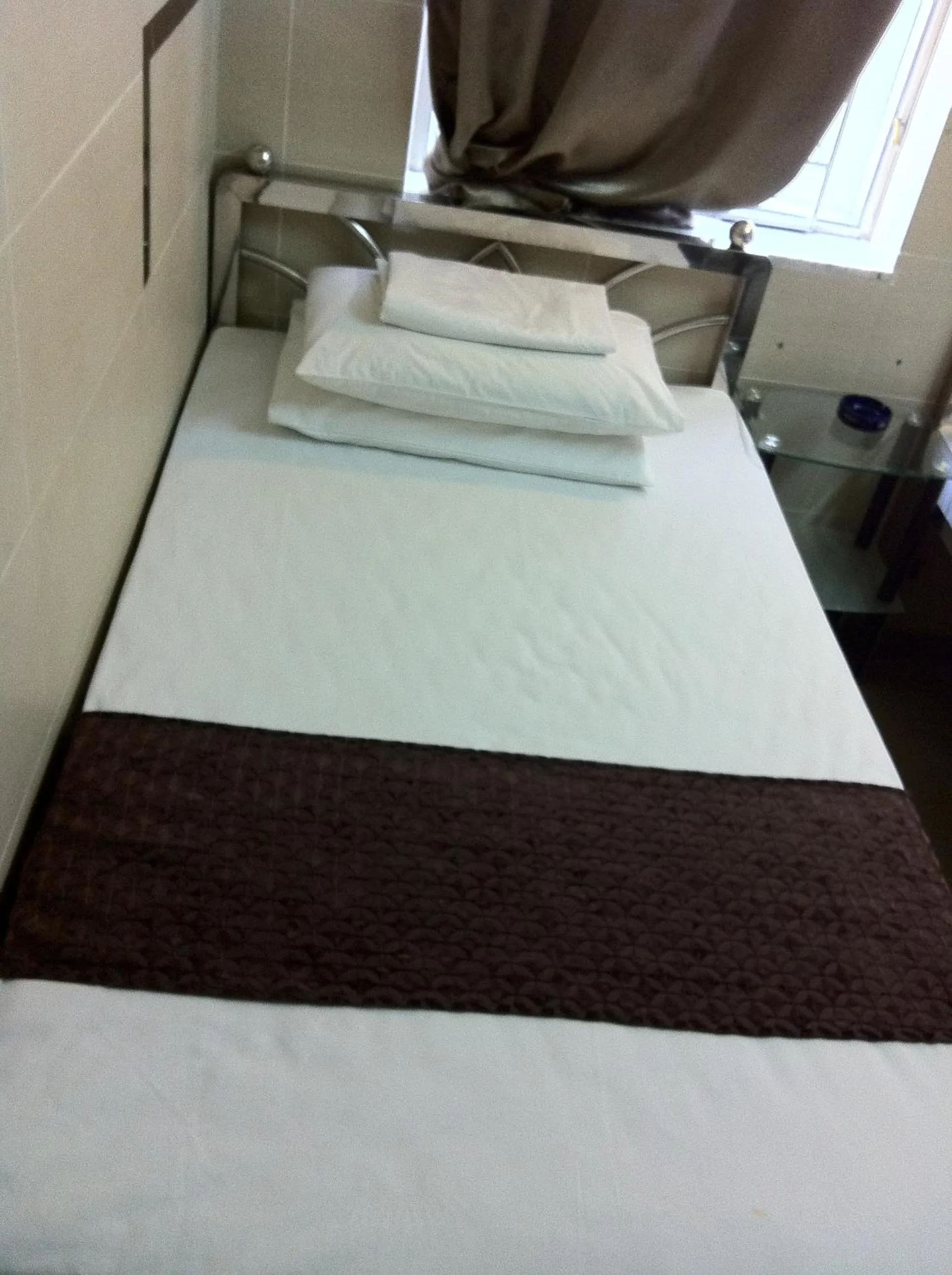 Bed in New Grand Guest House