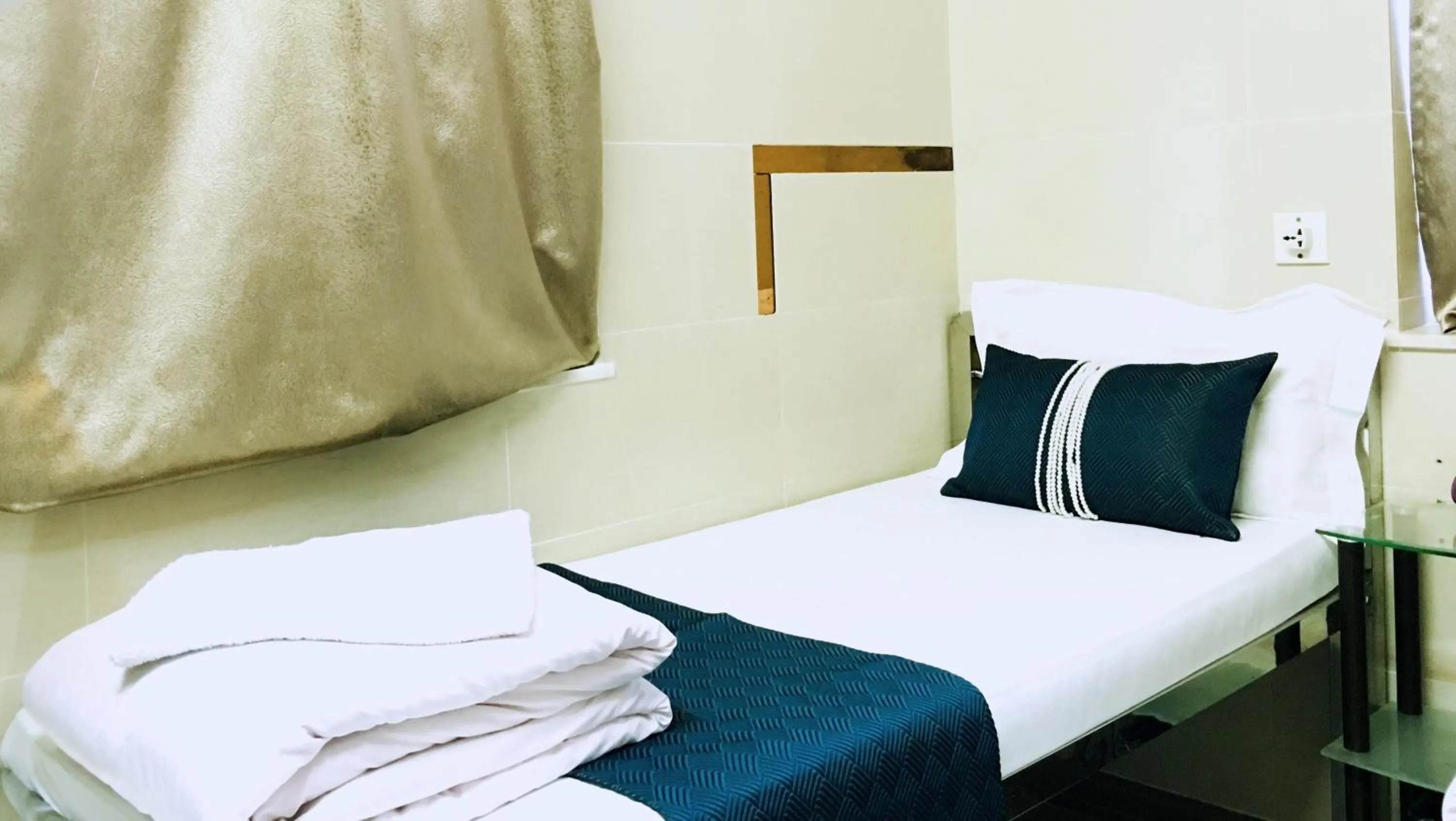 Bed in New Grand Guest House