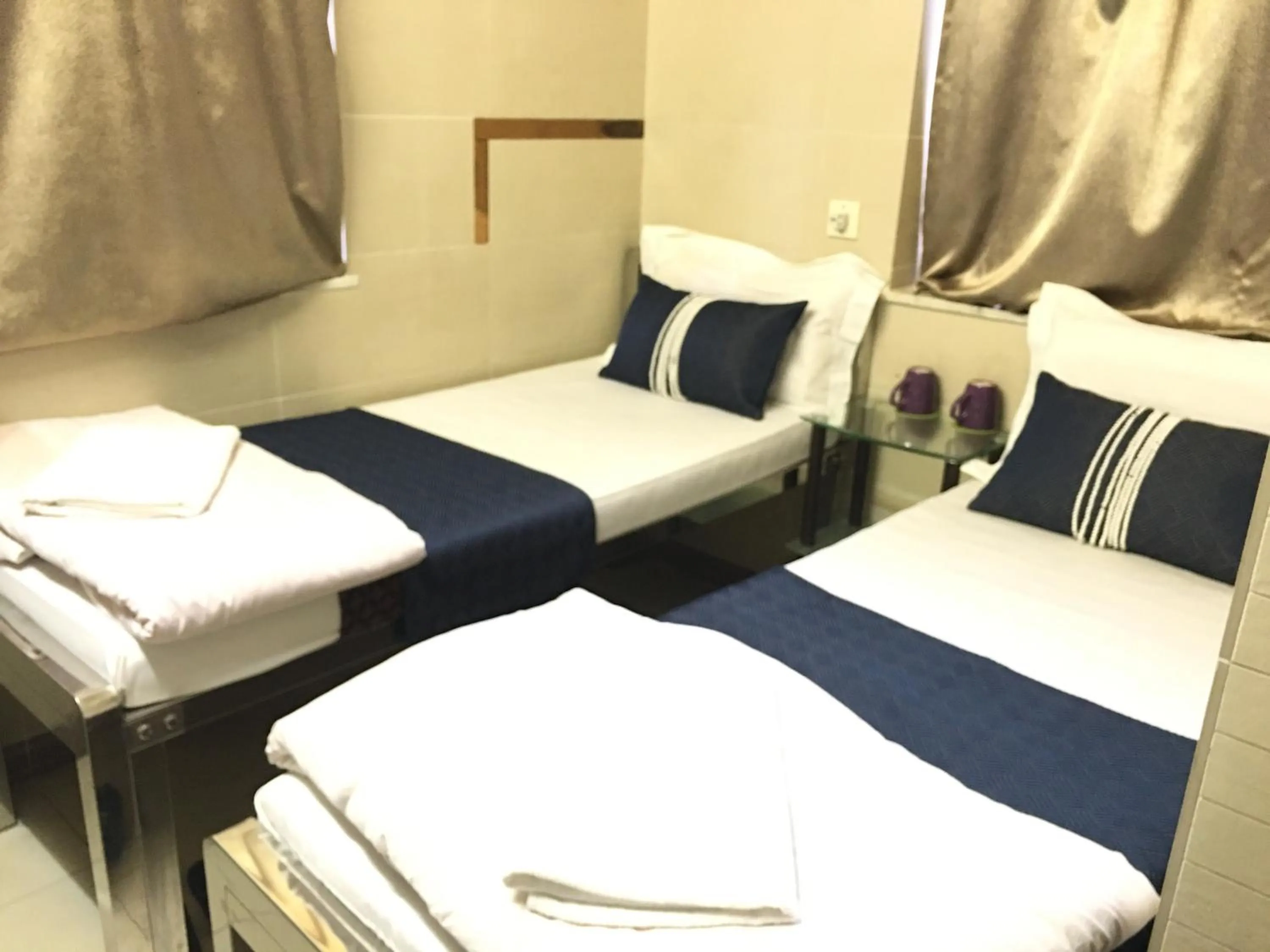 Bed in New Grand Guest House