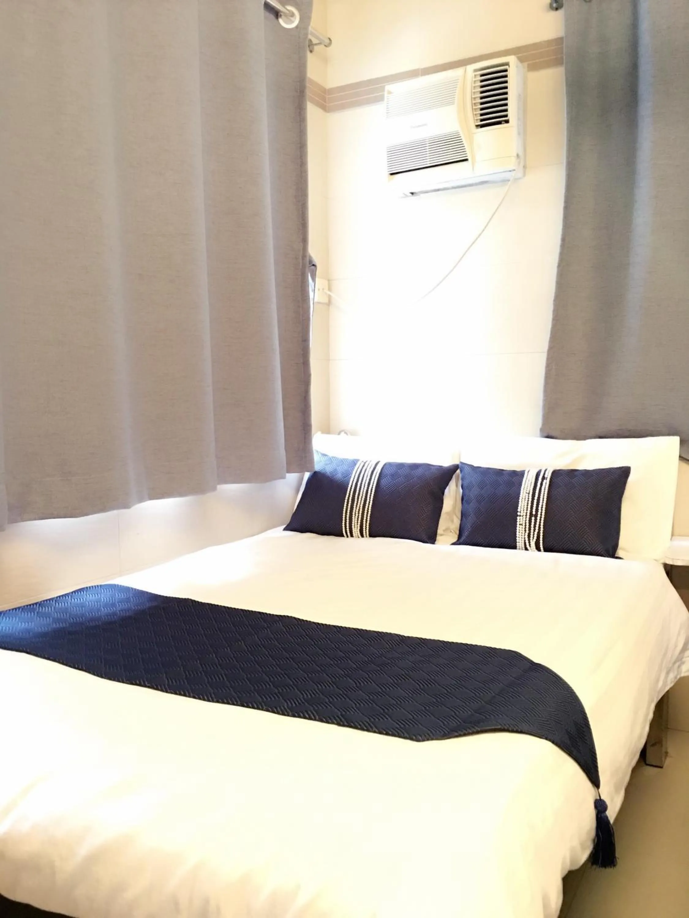 Bed in New Grand Guest House
