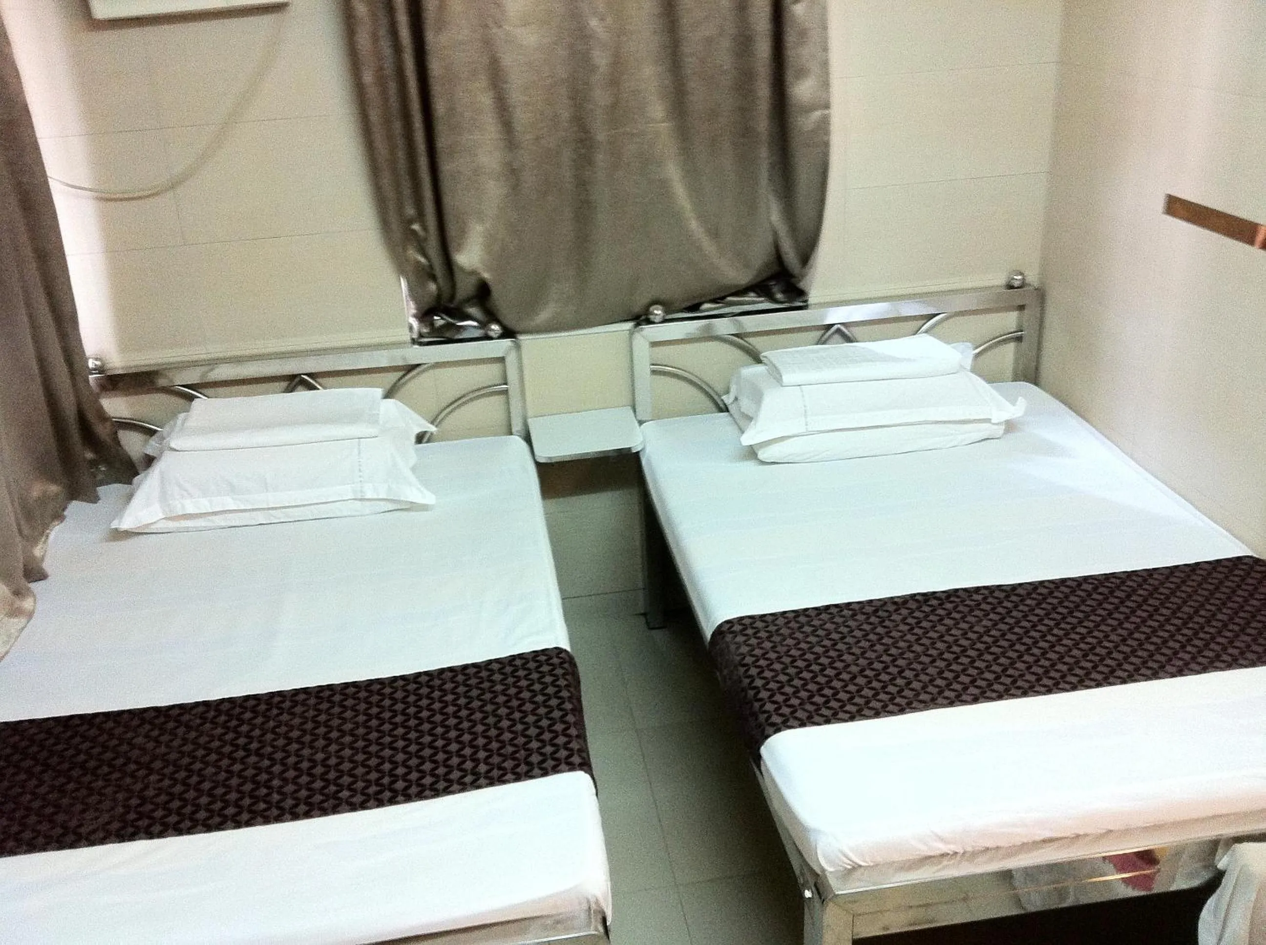 Bed in New Grand Guest House