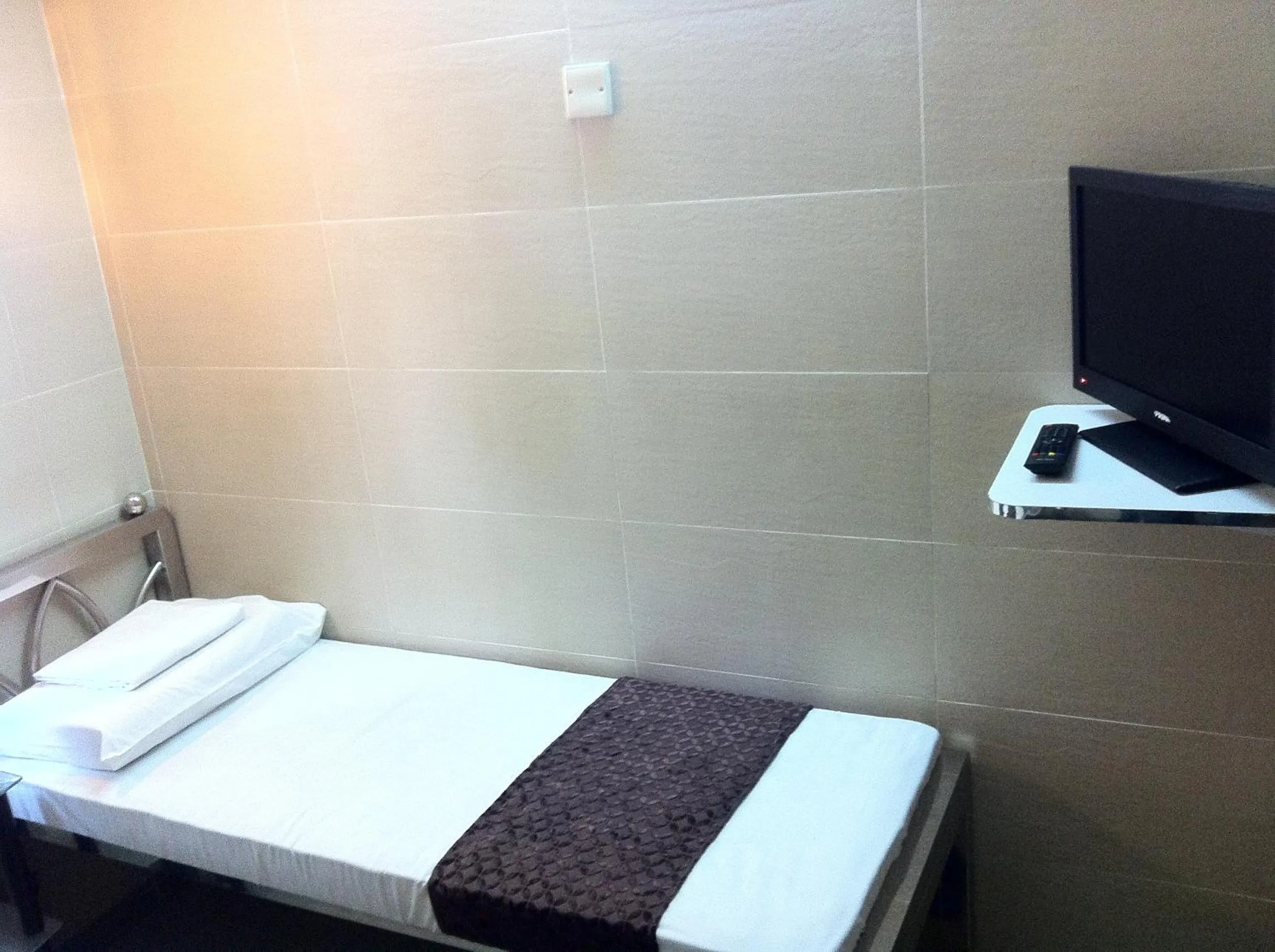 Bed in New Grand Guest House