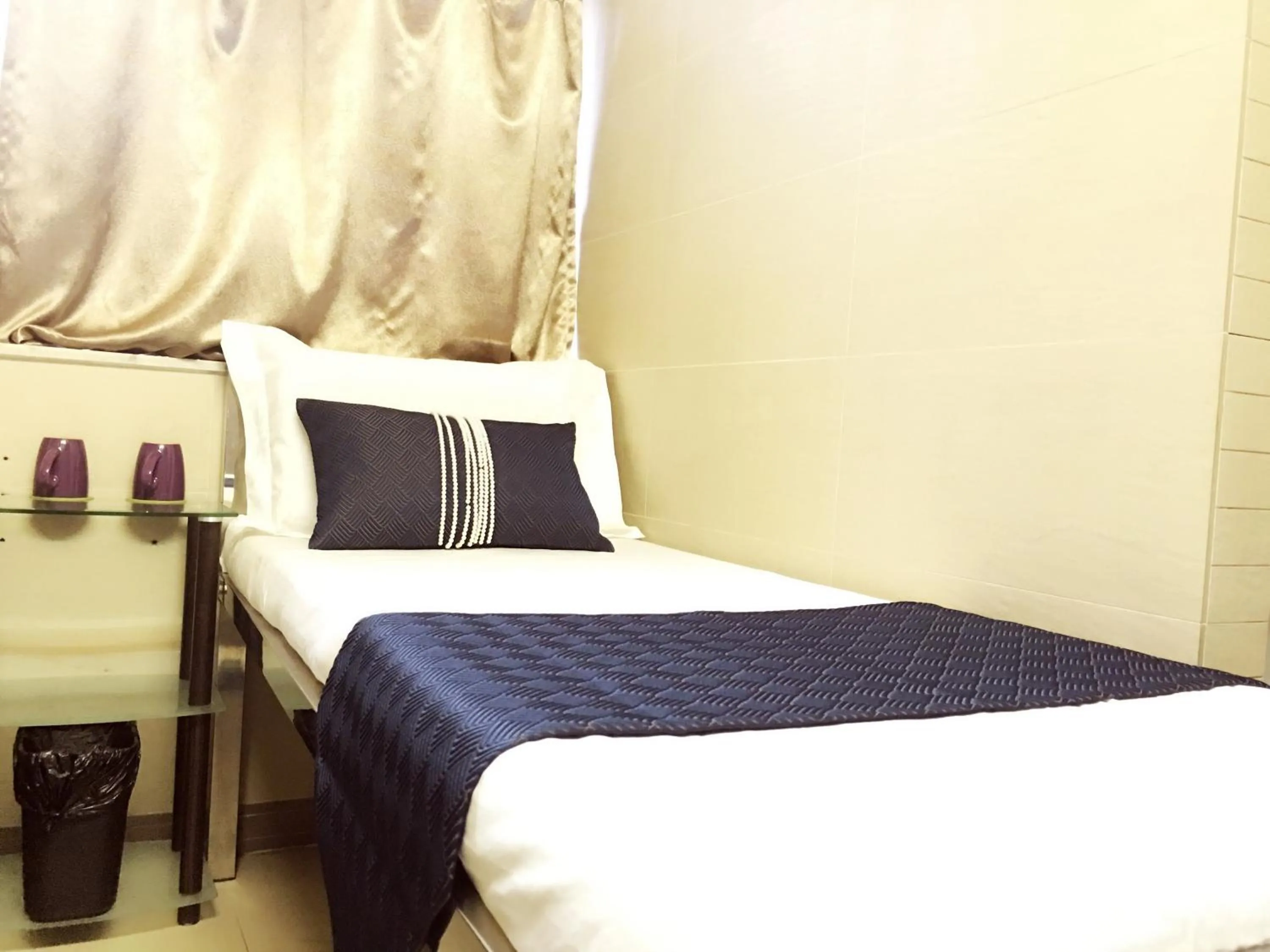 Bed in New Grand Guest House