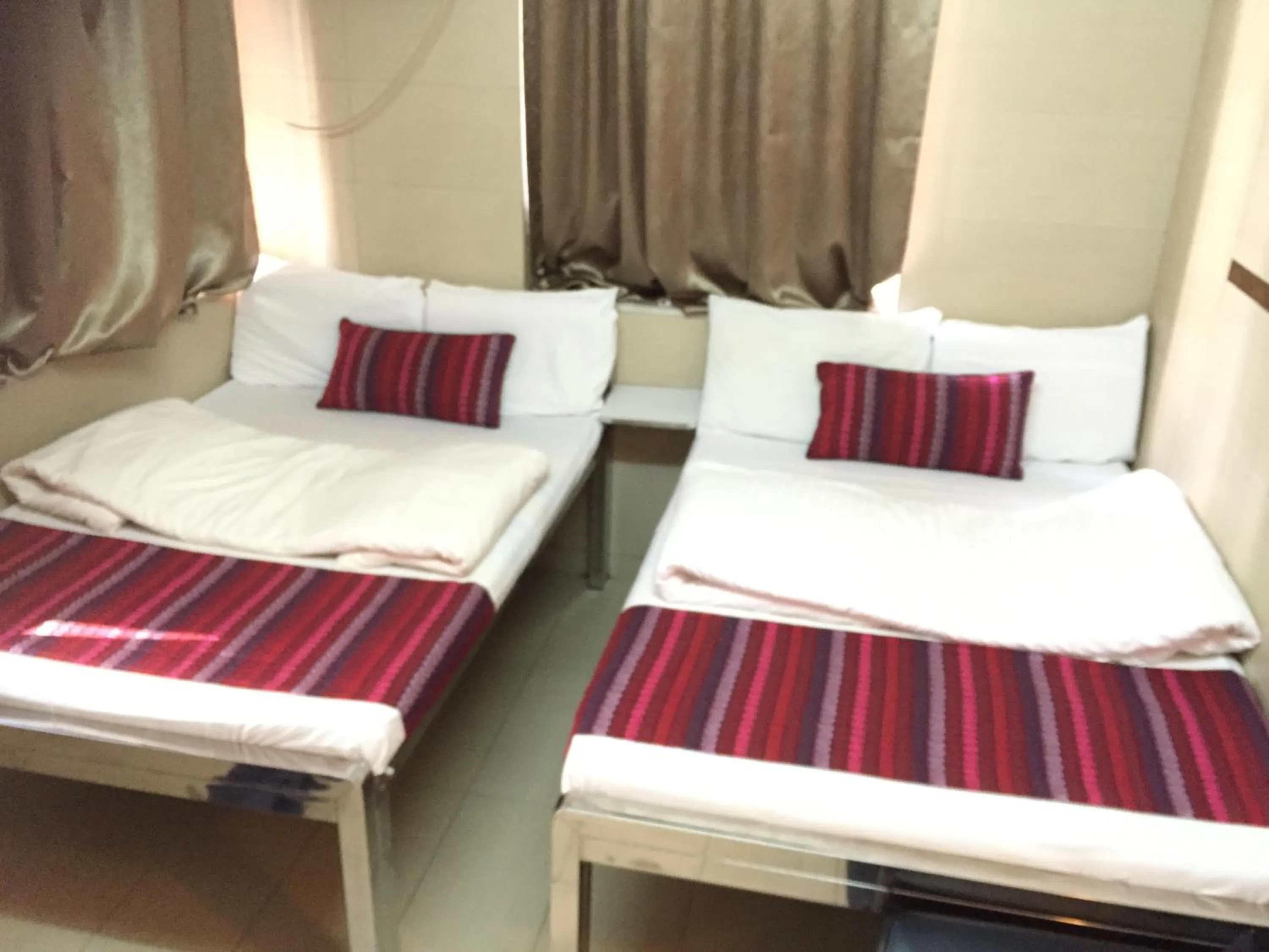 Bed in New Grand Guest House