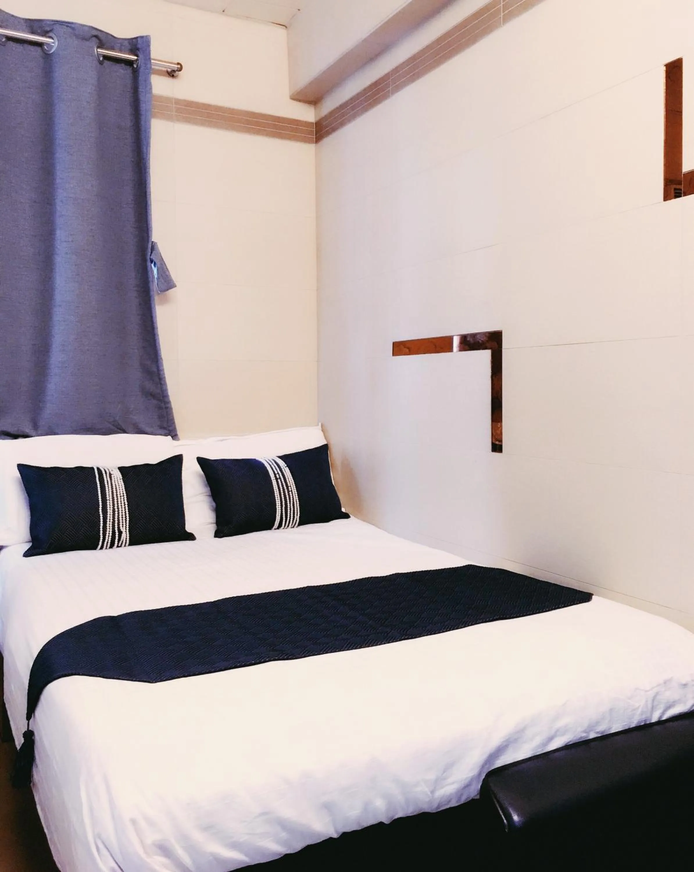 Bed in New Grand Guest House