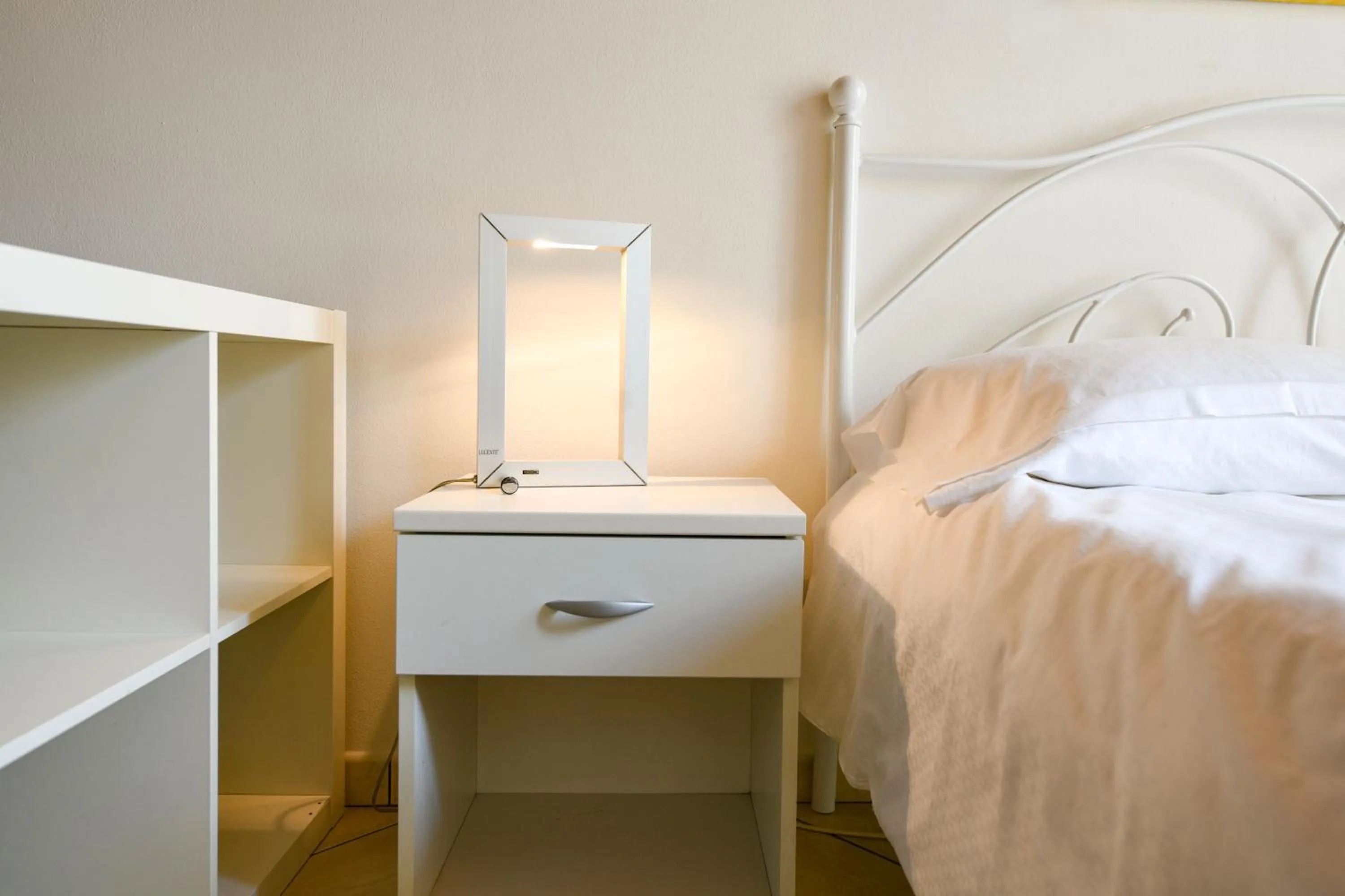 Bed in Flowers Apartments