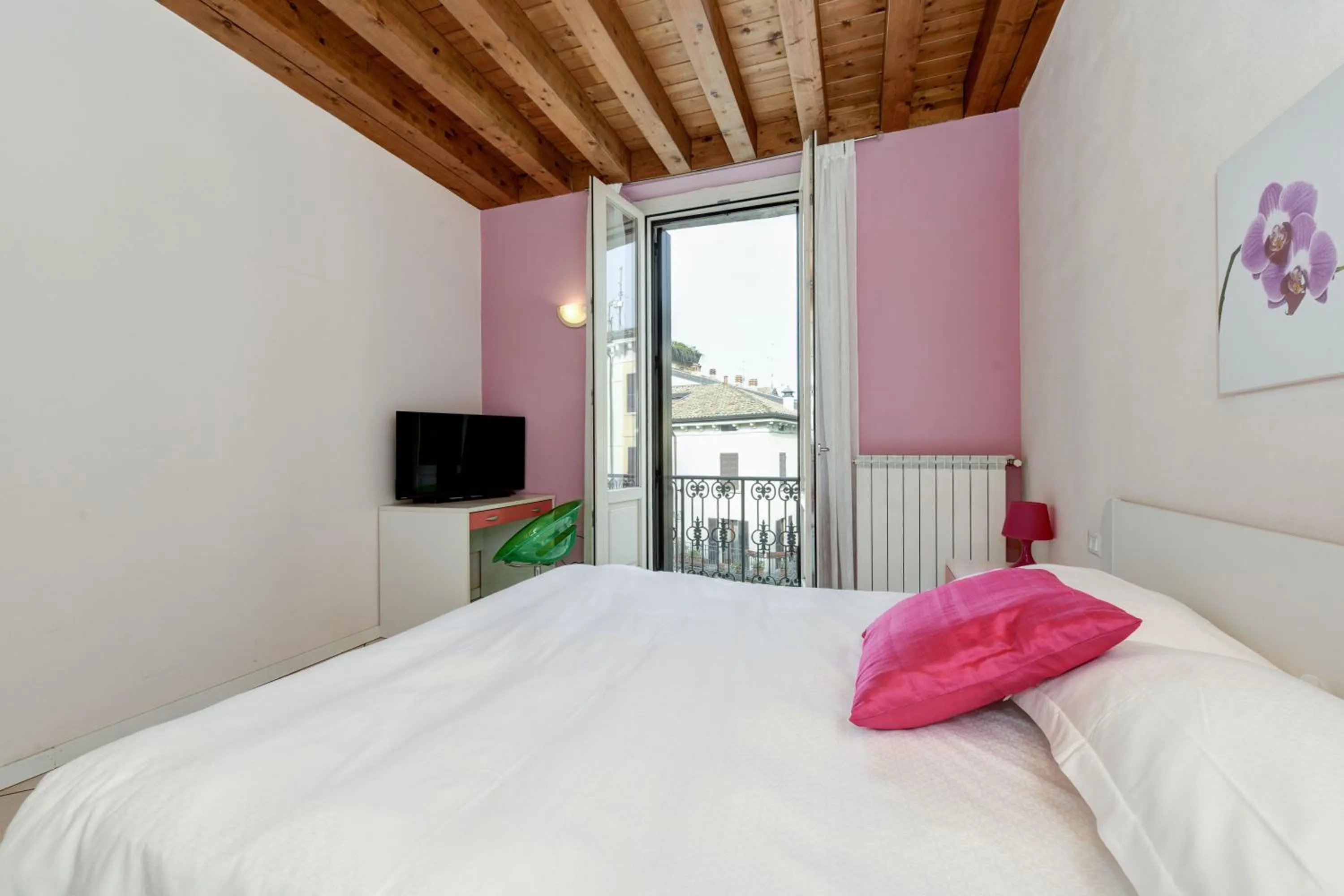 Bed in Flowers Apartments