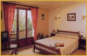 Photo of the whole room, Bed in Hôtel Les Chamois