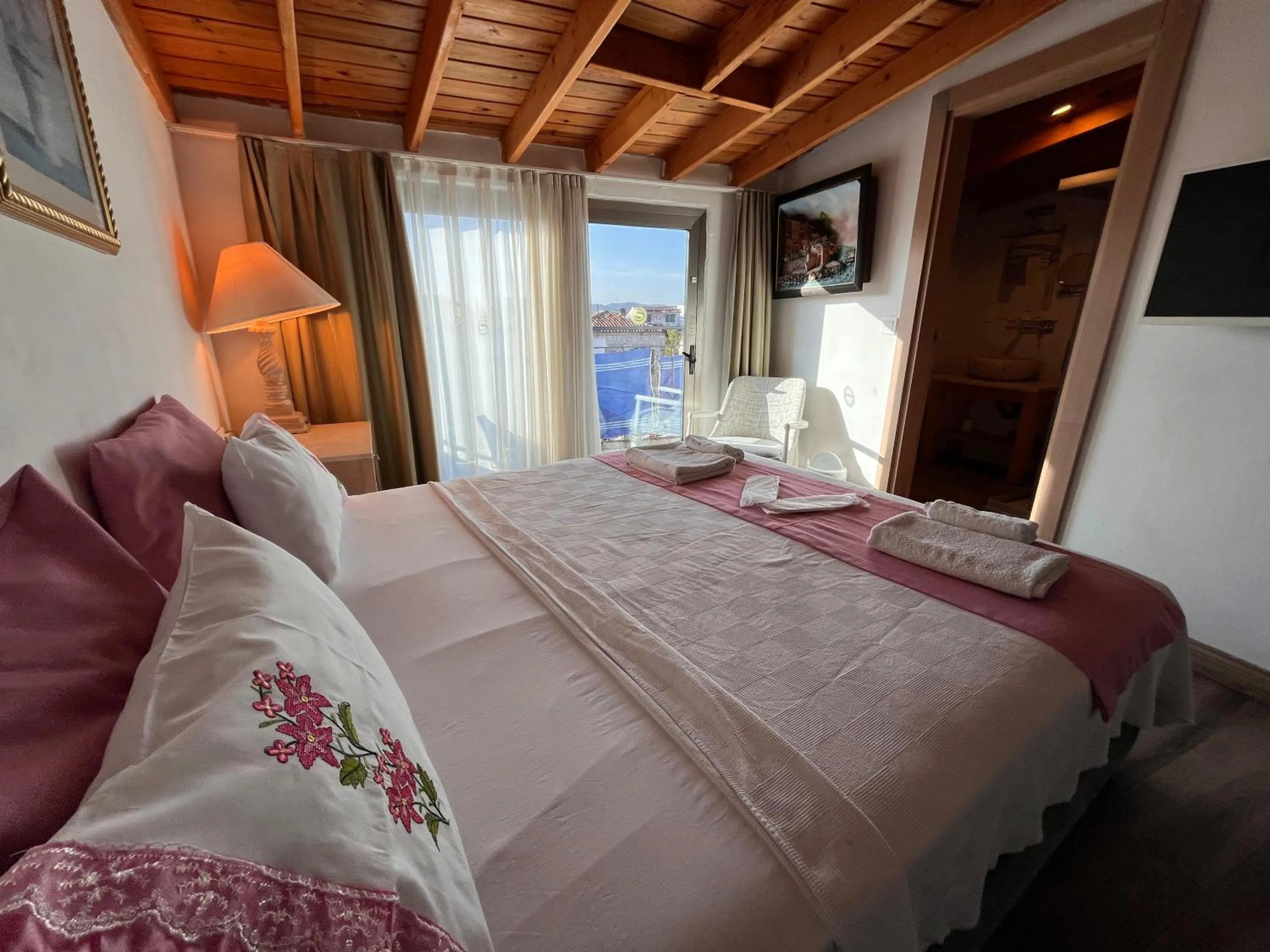 Photo of the whole room, Bed in Alacati Asmali Konak Hotel