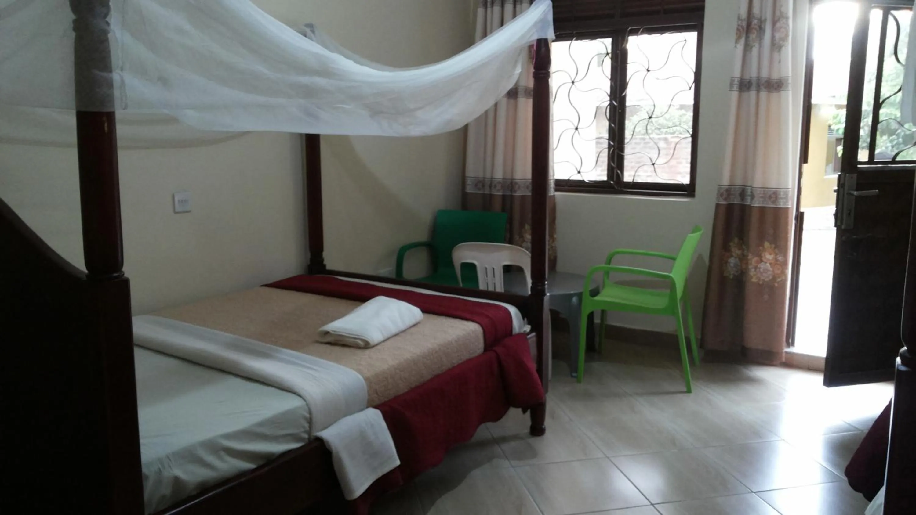 Bedroom in Kalalo Cottage Inn