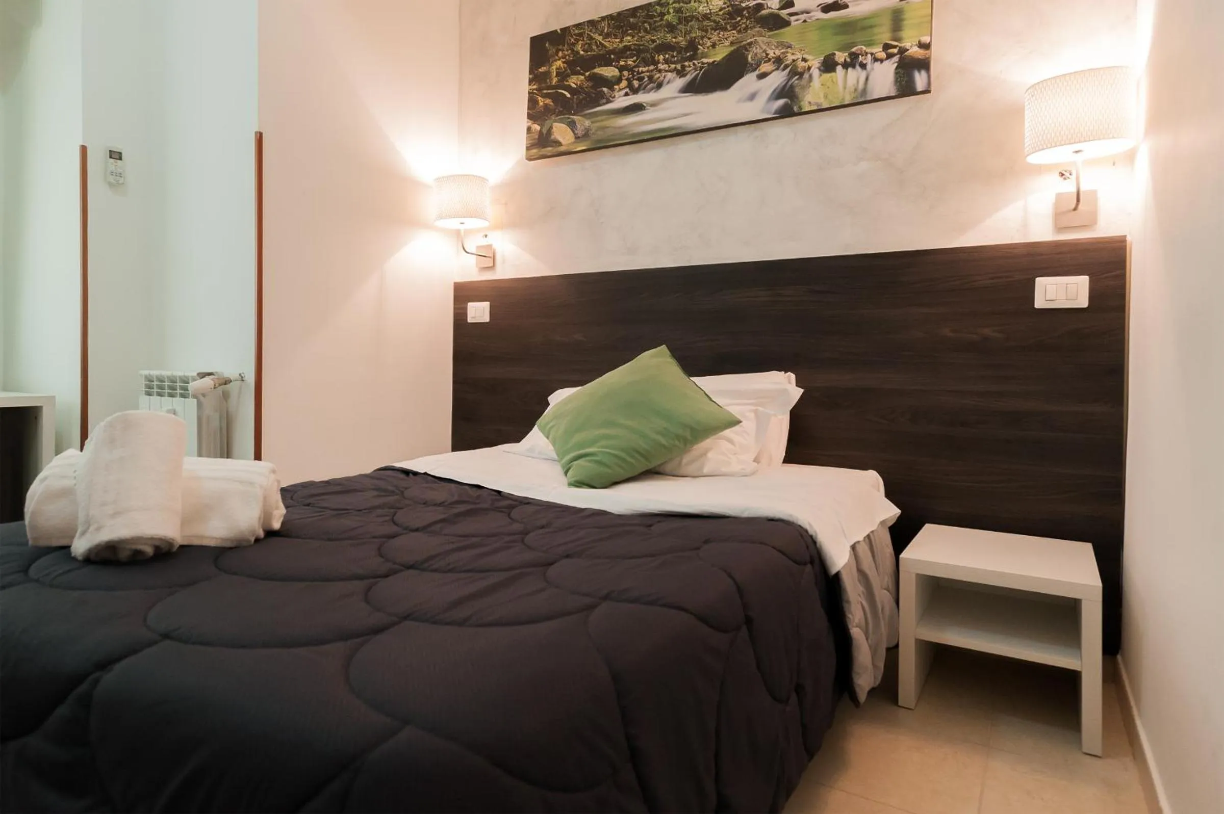 Bed in TIBURTINA INN GUEST HOUSE