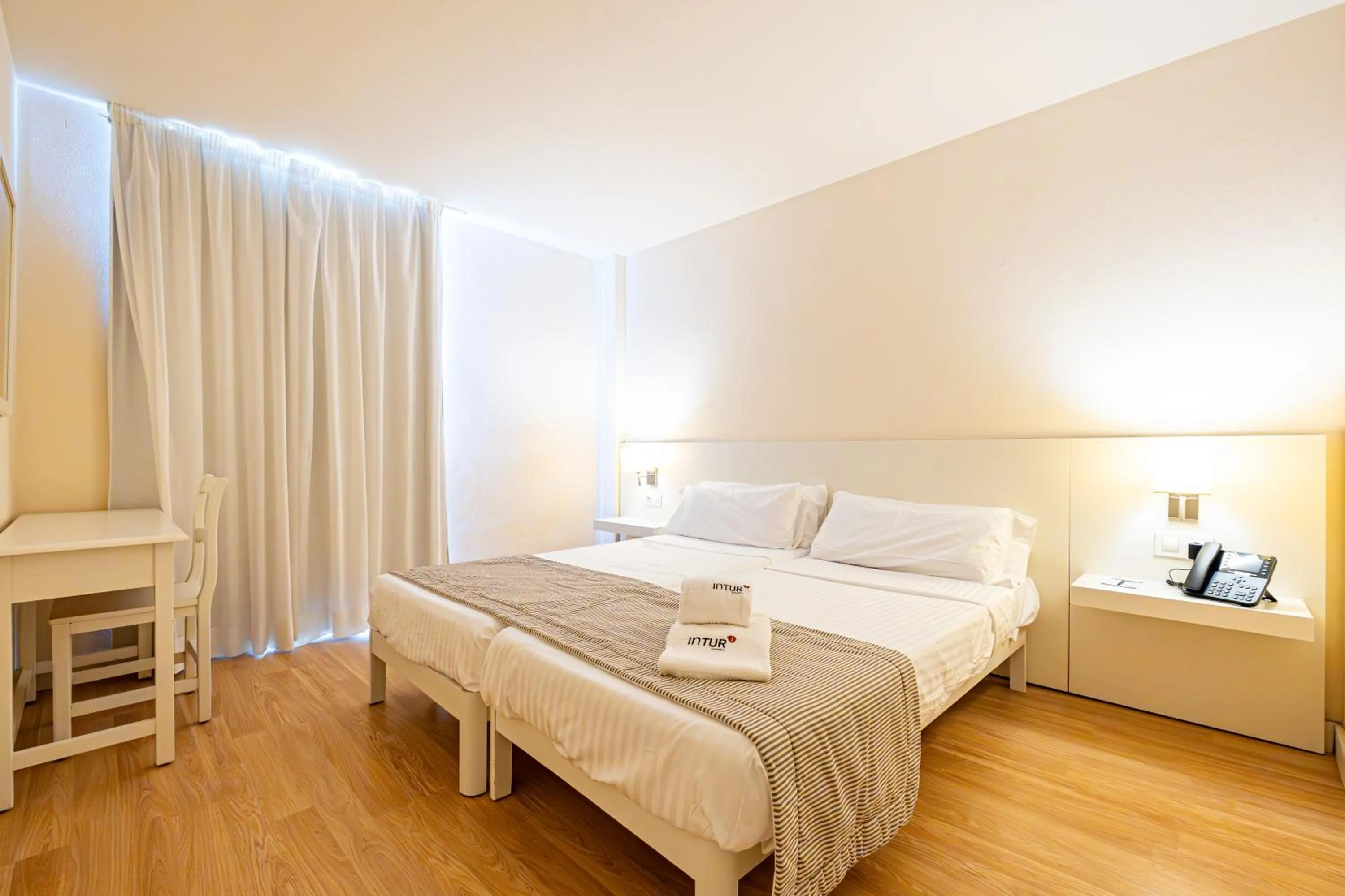 Bed in Hotel Rosella affiliated by Intelier