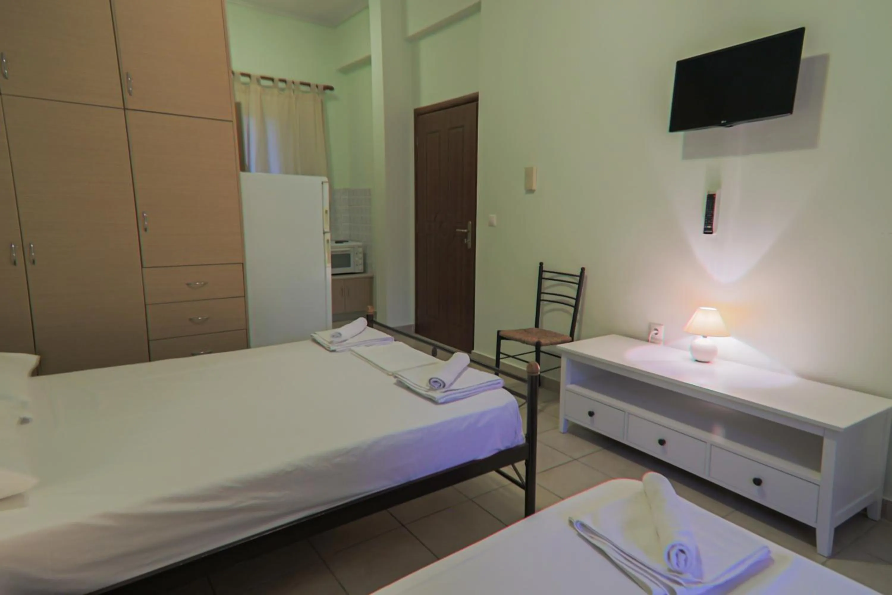 Bed in Tsertos Apartments