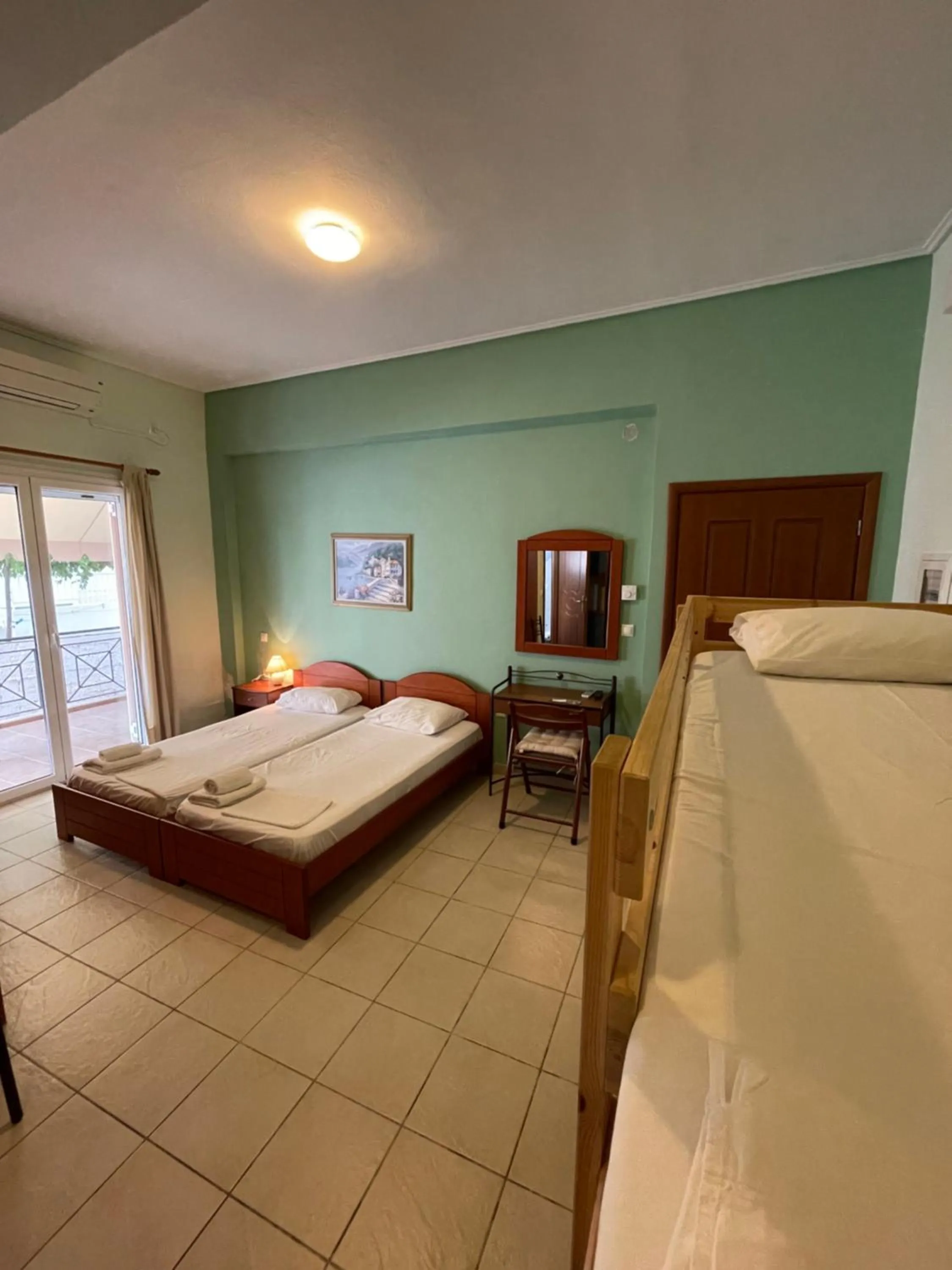 Bed in Tsertos Apartments