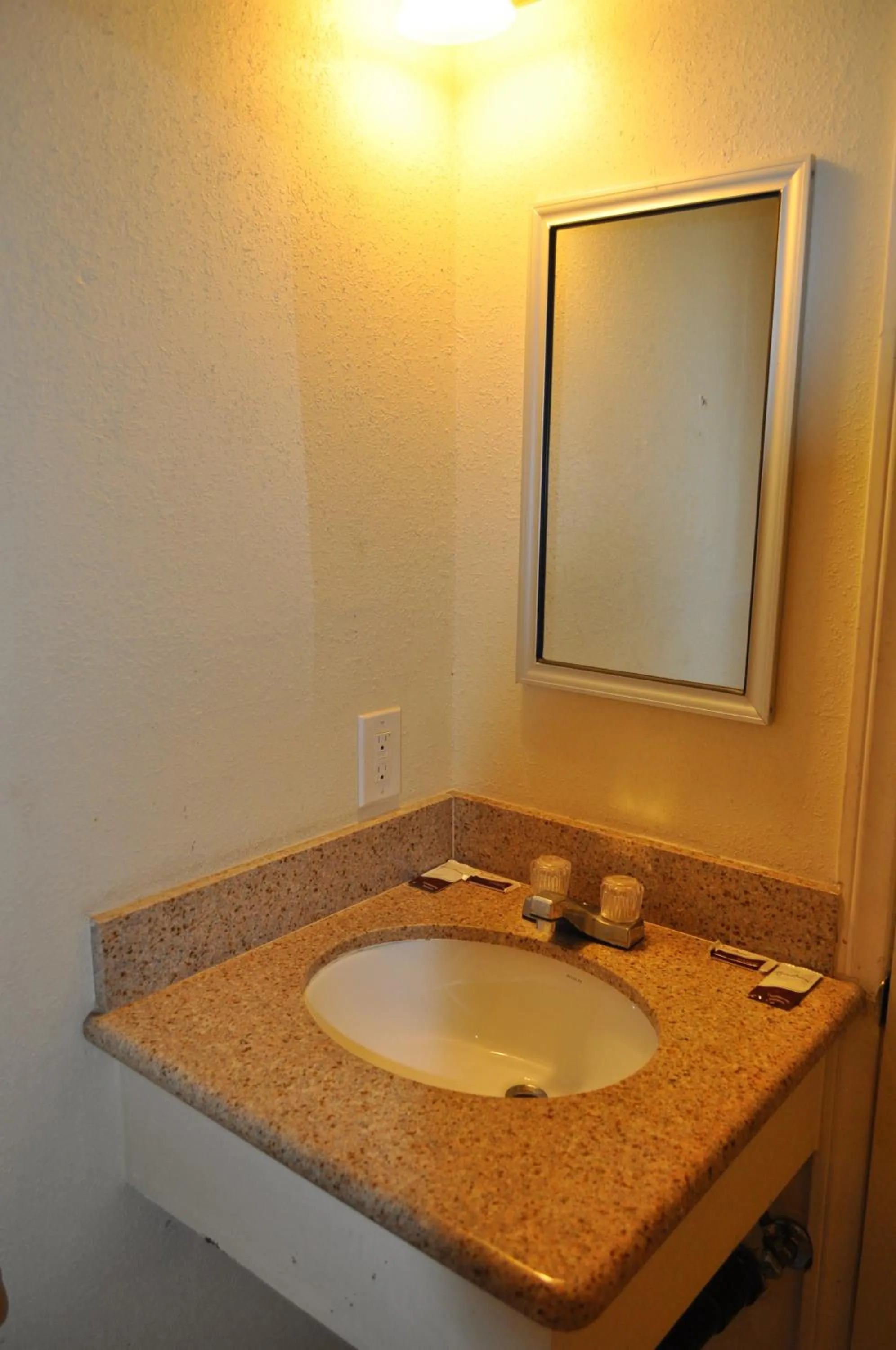 Bathroom in California Suites Motel