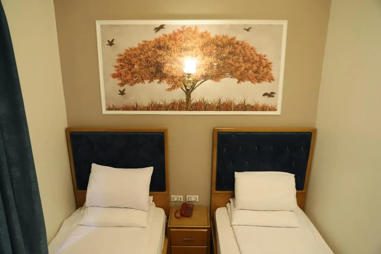 Bed in Golden Palace Hotel