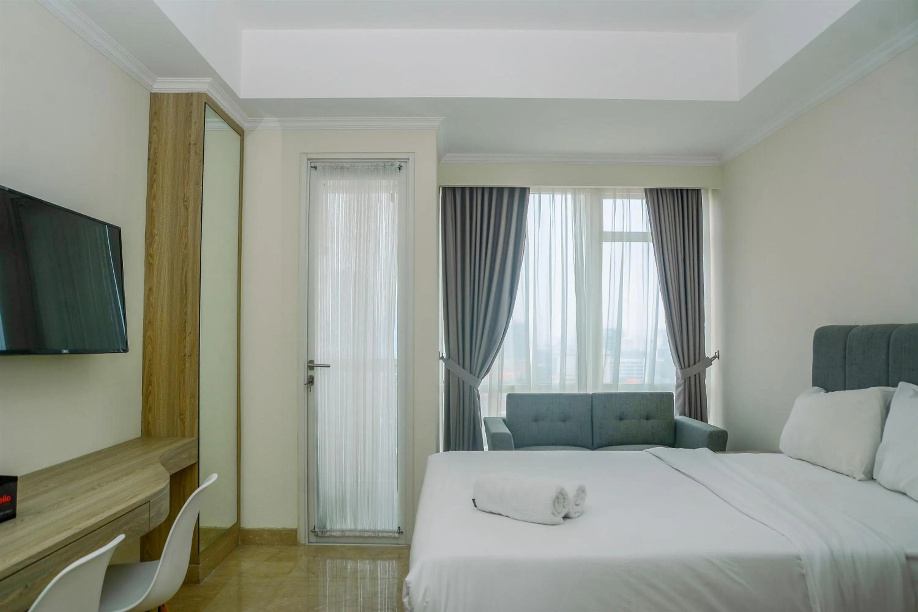 Bed in Modern and Cozy Studio Menteng Park Apartment By Travelio