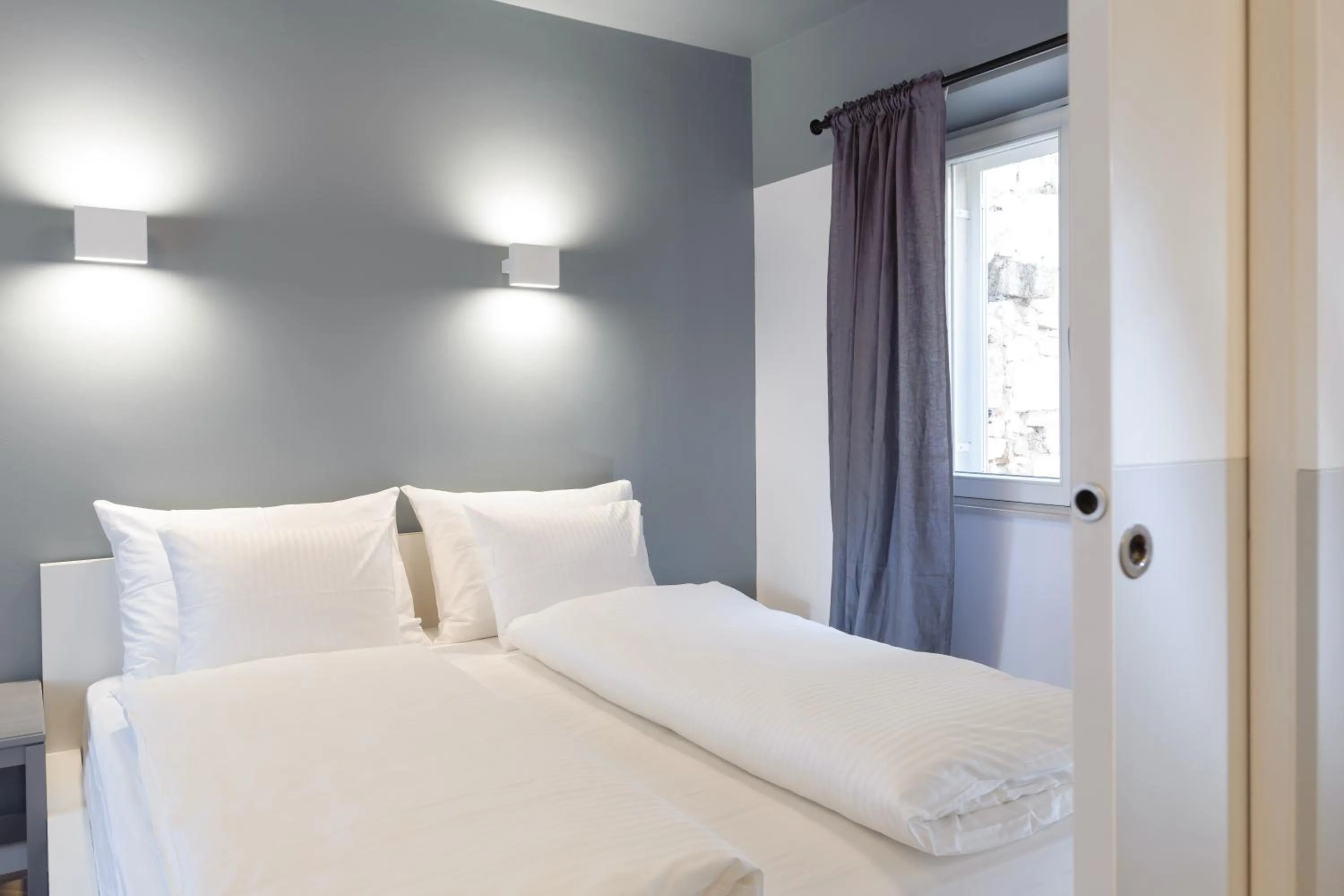 Bed in MK Luxury Rooms