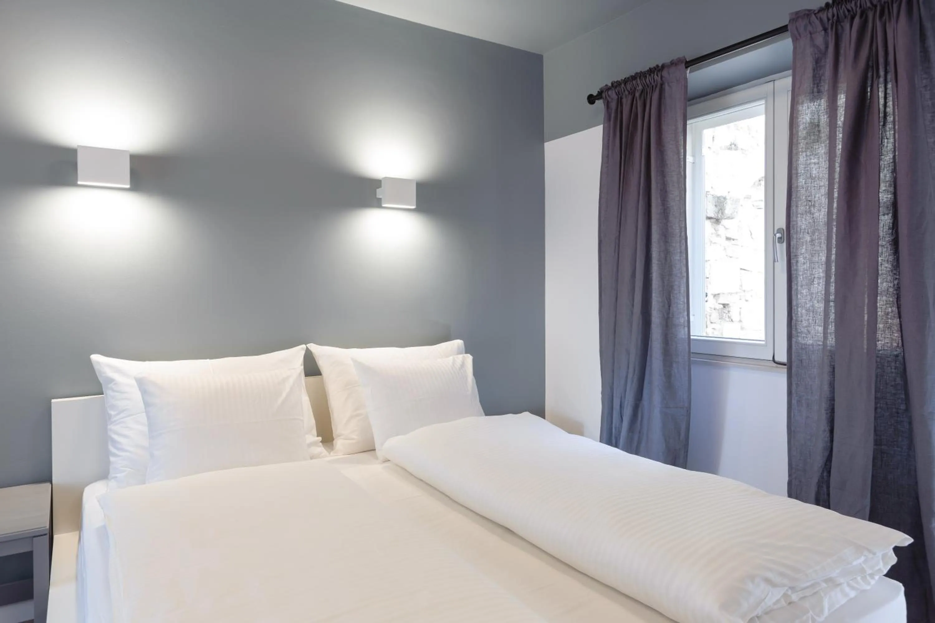 Bed in MK Luxury Rooms