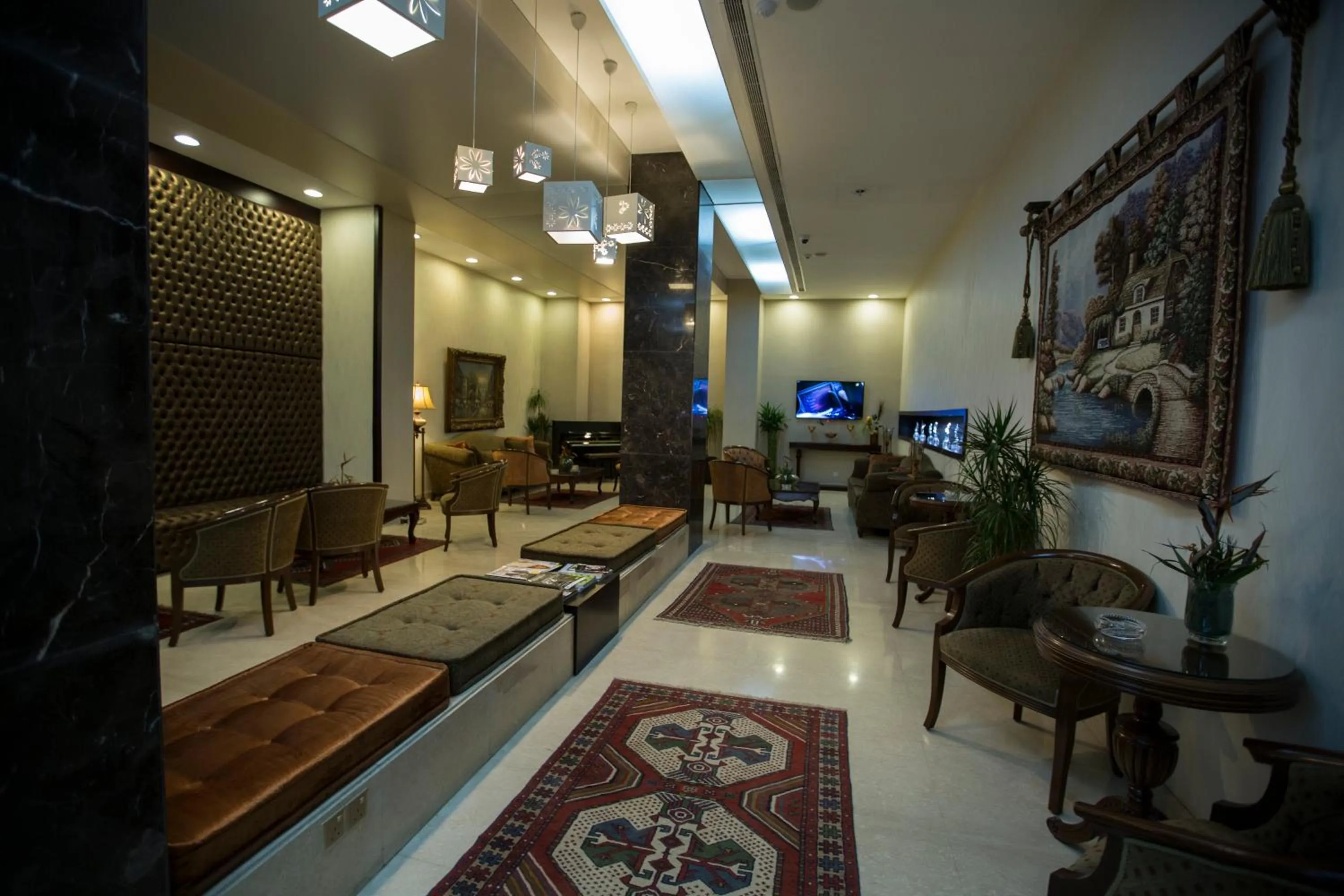 Communal lounge/ TV room in Fiori Hotel