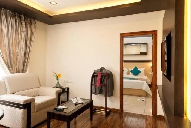 Living room, Bed in Hotel Southern Grand