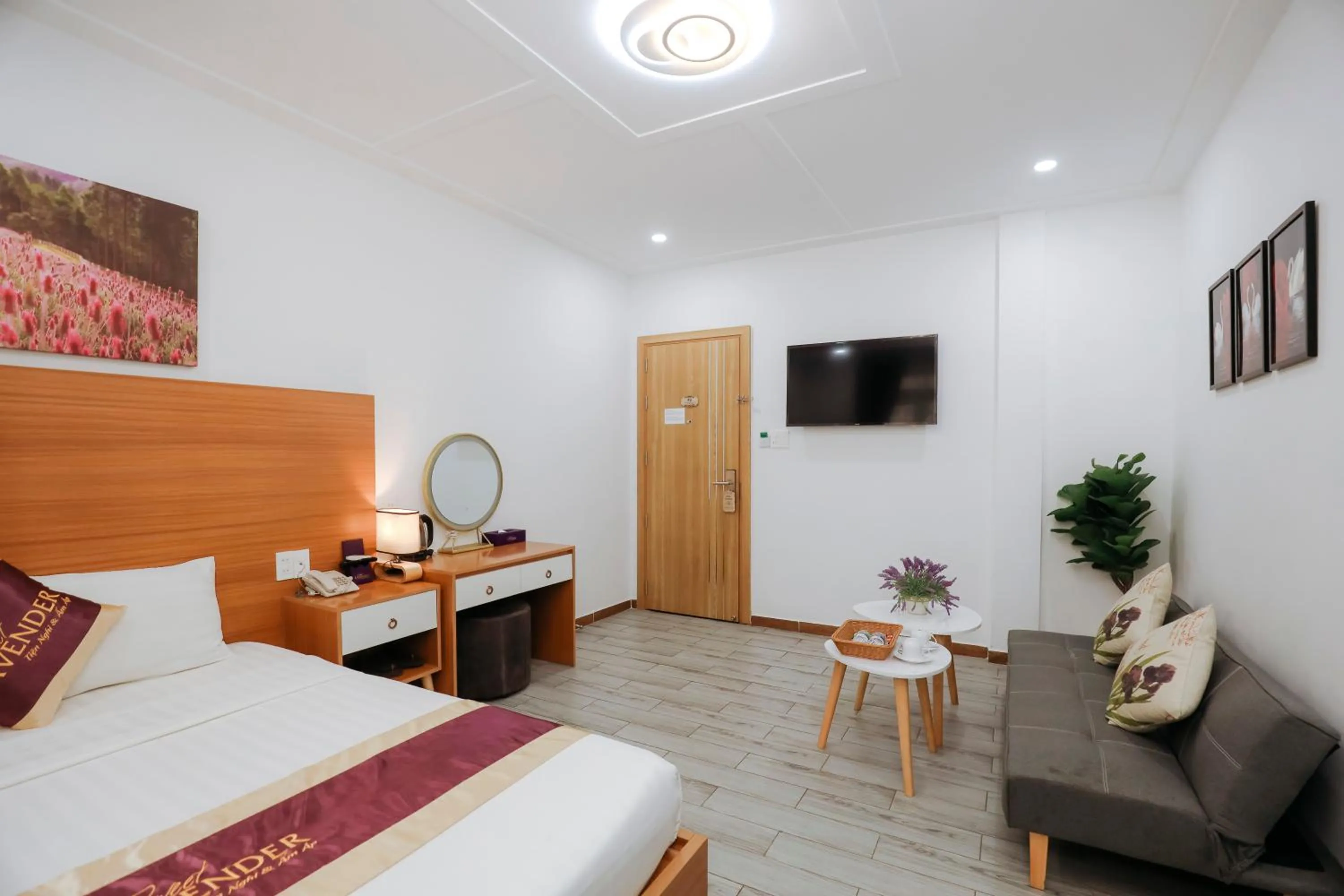 Communal lounge/ TV room, Bed in Sweet Lavender Hotel