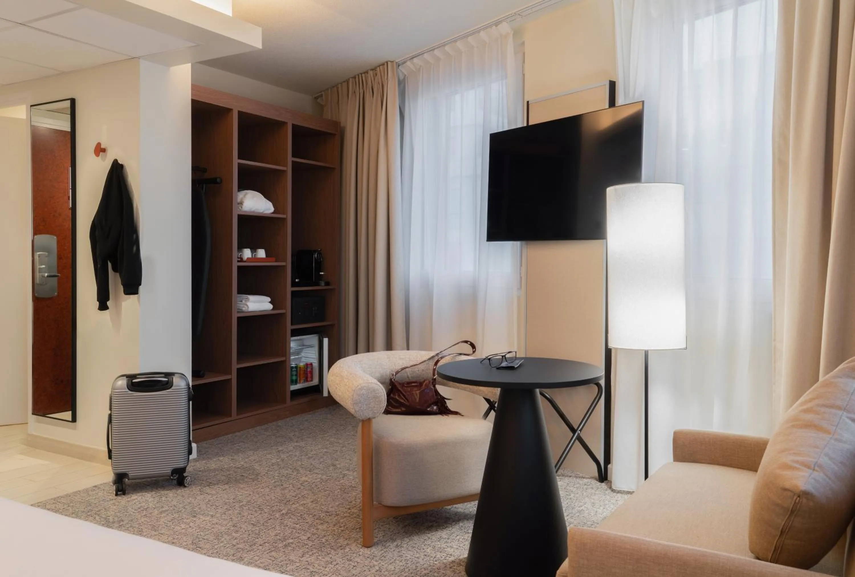 Communal lounge/ TV room in Mercure Paris Ivry Quai De Seine