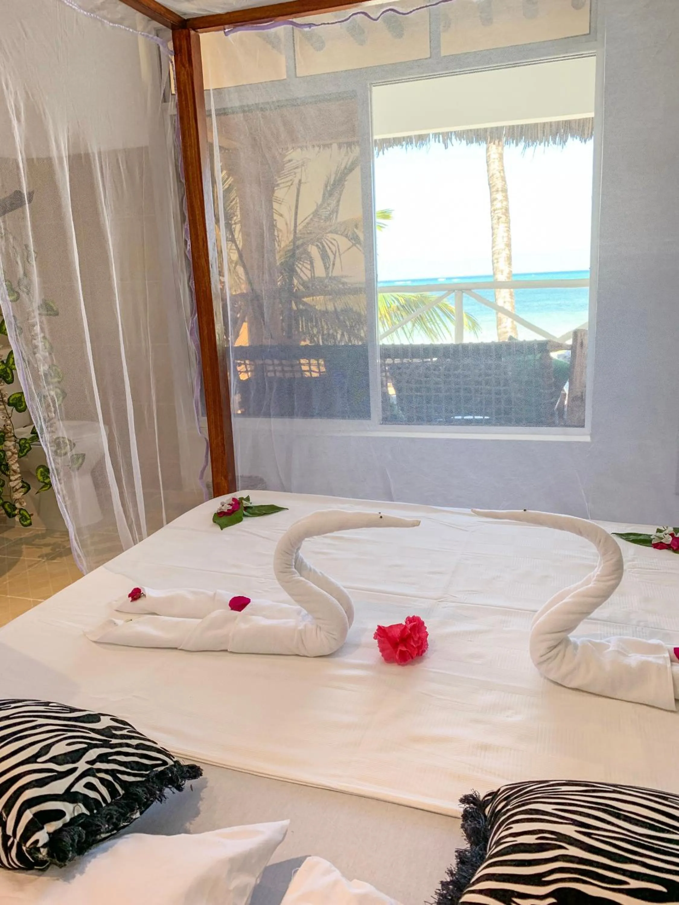 Bed in The African Paradise Beach Hotel