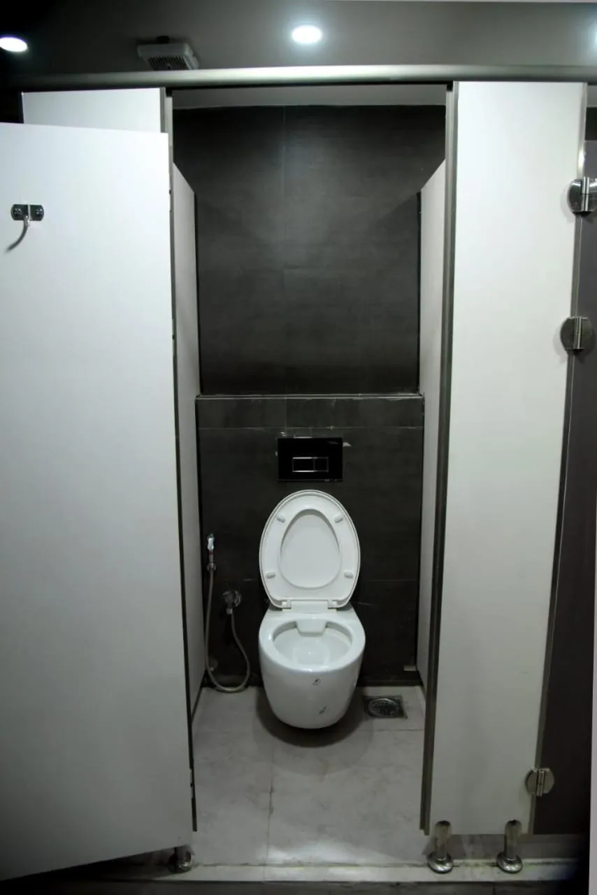 Bathroom in CHARYANA HOTEL AC DORMITORY