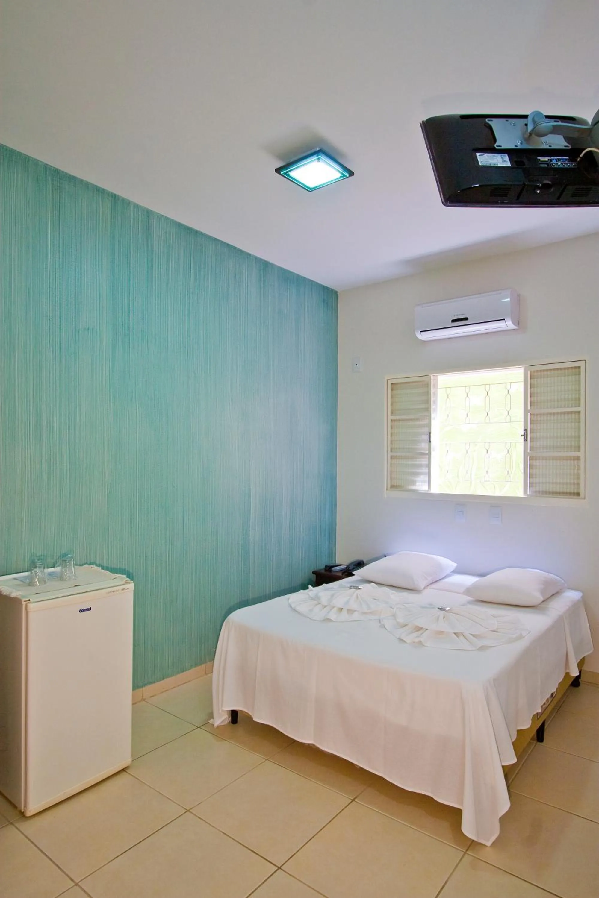 Bed in Hotel Pousada Calliandra