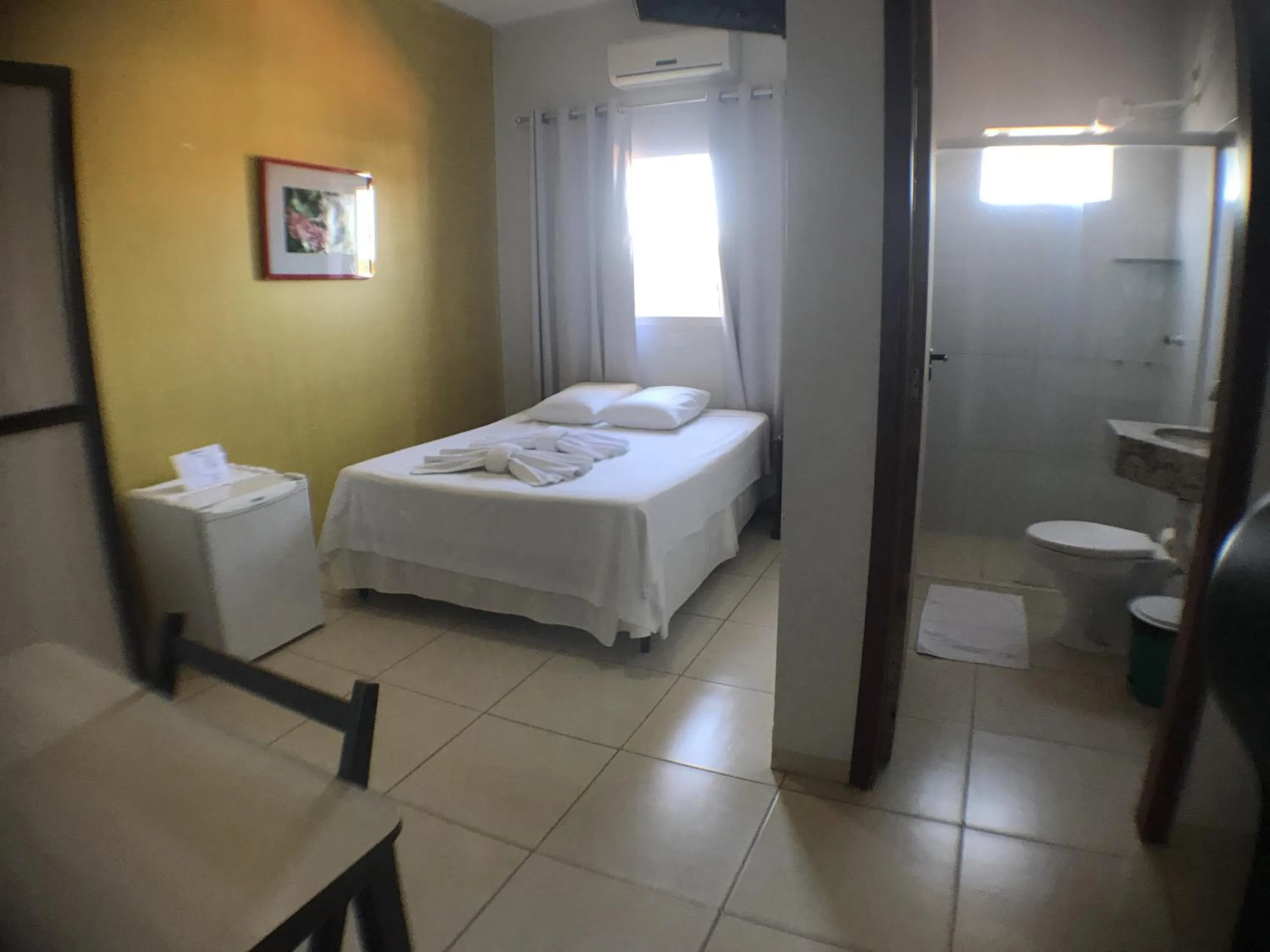 Bed in Hotel Pousada Calliandra