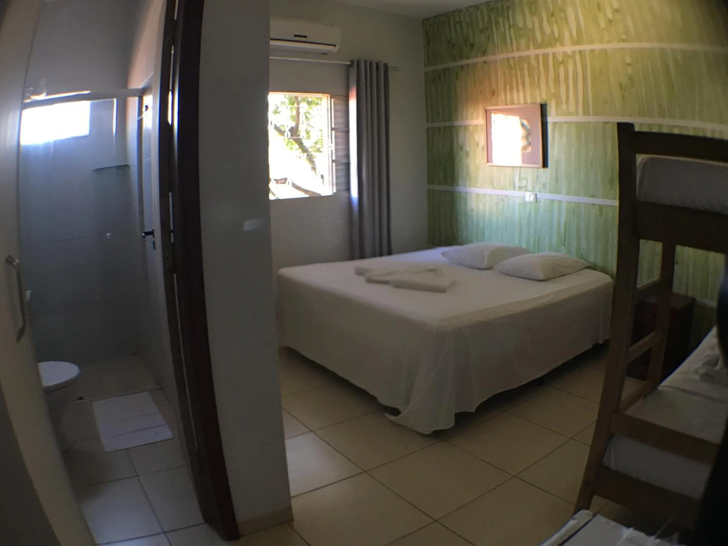 Bed in Hotel Pousada Calliandra