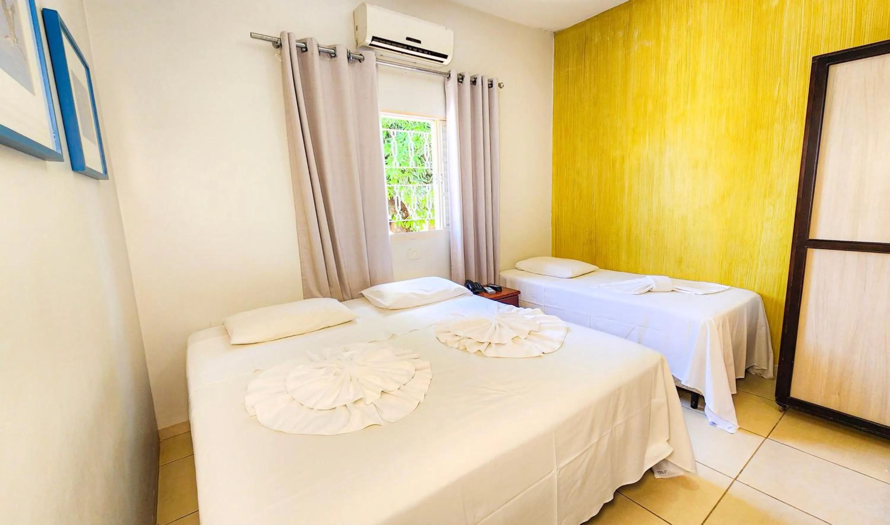 Bed in Hotel Pousada Calliandra